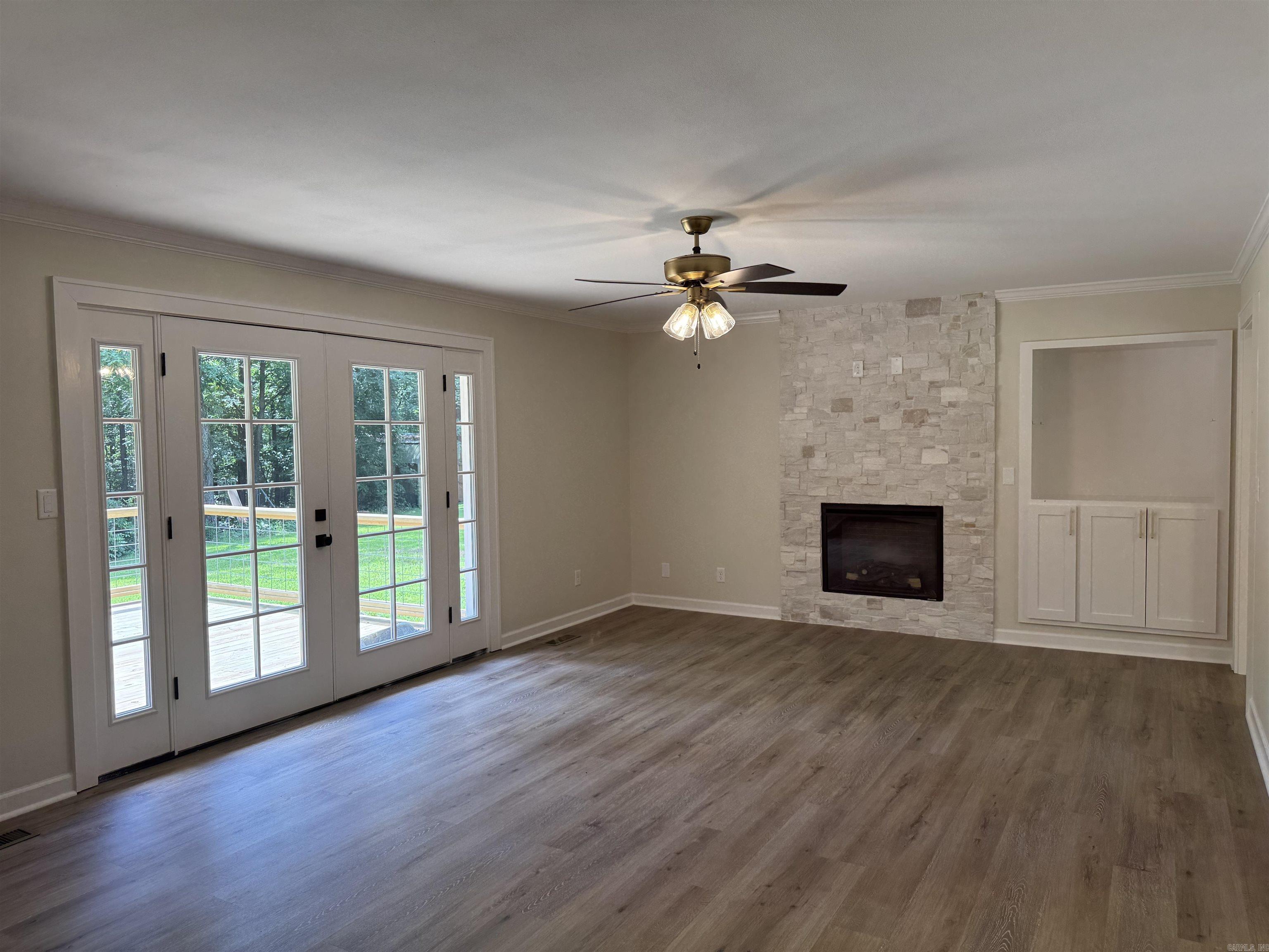 French doors lead to deck, backyard.