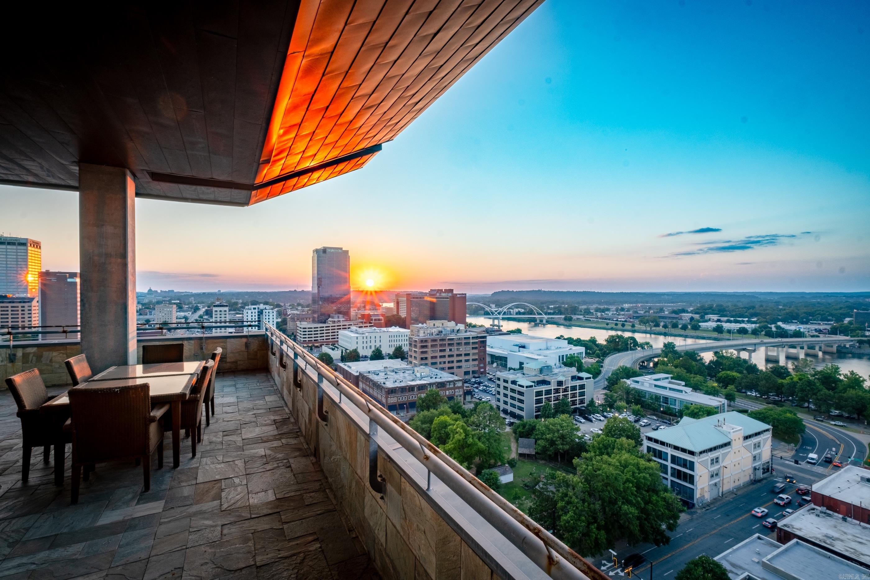 Luxury living in the heart of downtown Little Rock!  This penthouse condominium has never before been offered for sale.  It showcases the best views of Little Rock and faces North & West. Immaculate and completely remodeled with designer touches, this 3 bedroom, 3 & ½ bath is truly one-of-a-kind.   Two separate entry foyers open to an elegant living/dining space with custom tray ceilings, flooded with natural light and floor-to-ceiling windows that showcase the Arkansas River and City of Little Rock. Gorgeous formal dining room with stunning double chandeliers. Walk outside to a massive flagstone wrap-around balcony. Spectacular custom chef’s kitchen is anchored w/stone countertops and Viking appliances. Lovely breakfast bar adds loads of charm. Richly appointed spaces include sophisticated art.  The indoor-outdoor spaces blend perfectly, making it an entertainer’s dream!  Two parking spaces on 2nd level next to the entrance. The property is being sold fully furnished.  There is concierge, security, a pool, dog walk, exercise room, and excellent restaurant. This is a unique opportunity to own a one-of-a-kind, exceptional luxury property! Agents, see remarks.