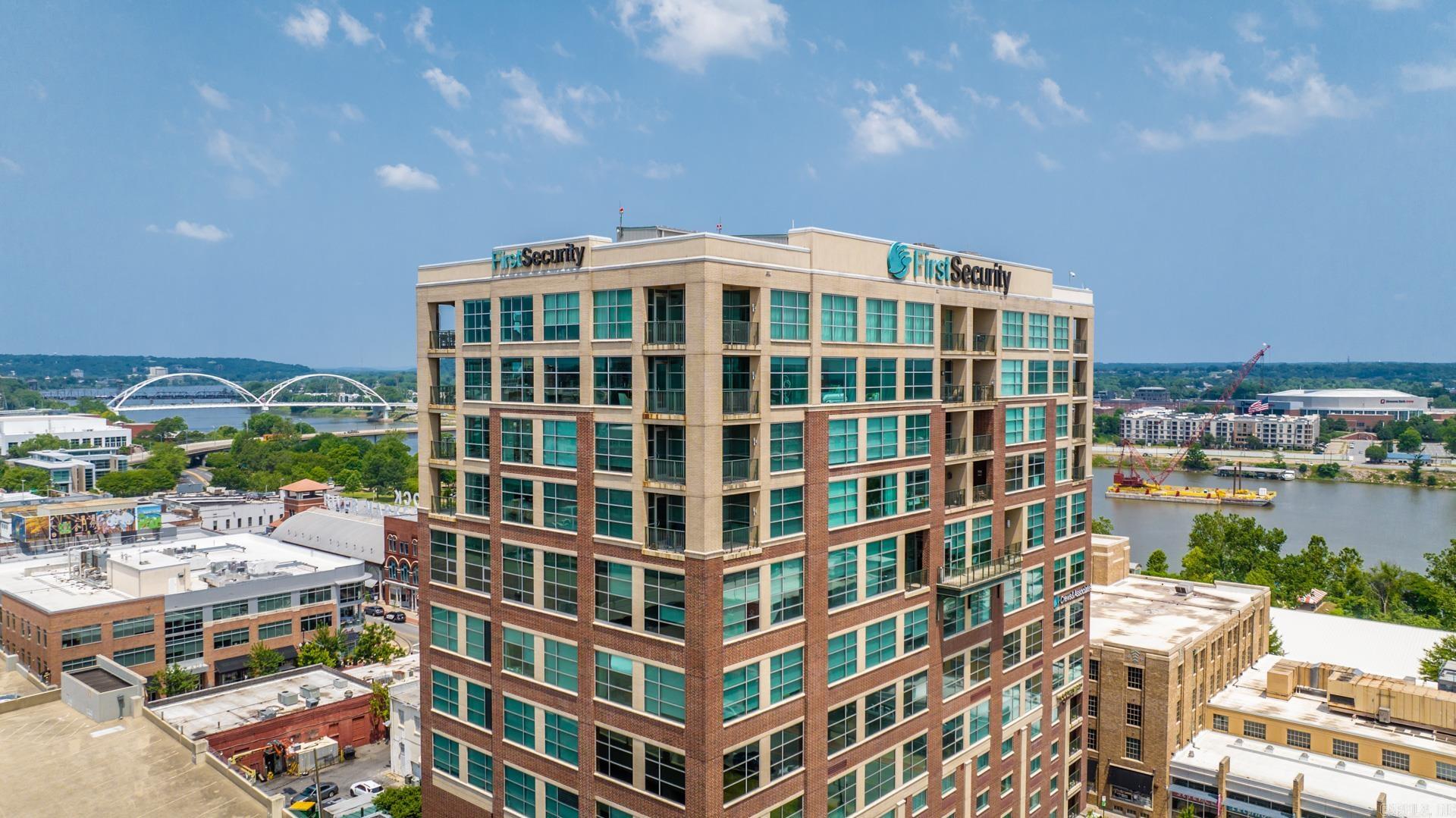 This is a rare opportunity to have a presidential party suite with 3 Beds & 3 Baths on the 13th floor of the First Security Tower - downtown. Through the stainless steel double doors is the immediately impressive open plan wrapped with views over downtown Little Rock & the Arkansas River.   The entertainer’s entry offers a dining space, a wonderful sitting room, and this complete southwest corner is wrapped with its own balcony.   Step into the kitchen that highlights a beautiful breakfast bar, a discreet pantry, and premium Viking appliances, including the built-in 6 burning gas stove, double convection ovens, double sinks, an ice maker, and breakfast area with a coffee corner and large living space with surround sound built-in. This Southeast corner is also wrapped with its own balcony.   Privately set apart through double doors is your Owners’ suite with West facing views over the Arkansas River, giving a front row seat to the events at First Security’s Amphitheater & the beautiful Broadway Bridge. This Primary suite has the built-in office space, and a double / knee-space vanity, jetted tub, walk-in shower, and dual walk-in closets.