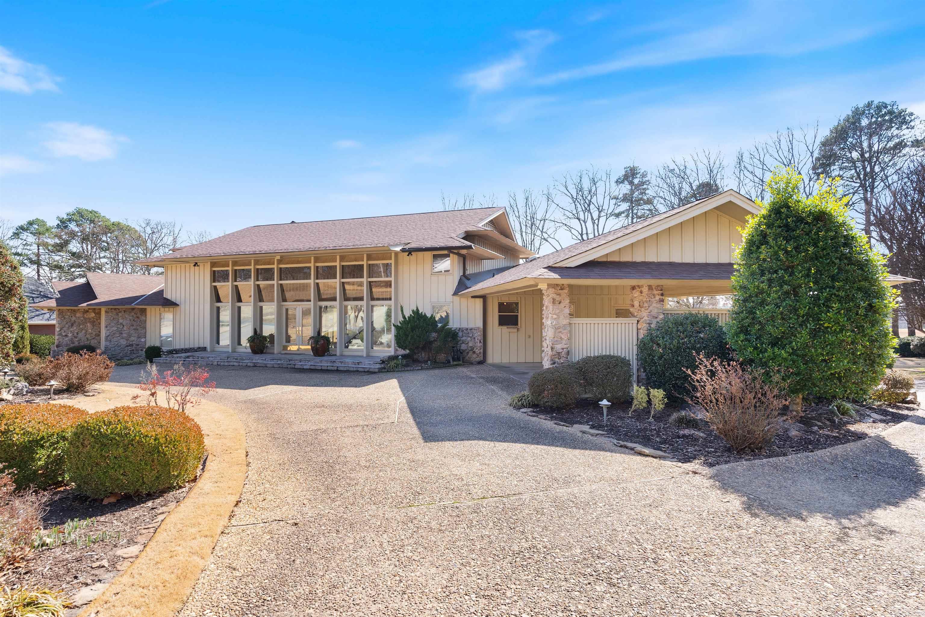Distinguished home designed with classic charm and modern sophistication built by architect Gordon Lee Pendergraft and later renovated by Jack Hartsell, Sr. This special home boasts a rich legacy of one owner who meticulously maintained and preserved this residence.The home is positioned on an incredible golf course lot and a half with serene views of the 27th hole on the Pleasant Valley Golf Course surrounded by lush trees and manicured grounds. The two-story entry is adorned with glass adjacent to the great room with wooden beams and Pella windows overlooking the pool patio. A formal dining room is open to the gourmet kitchen with vaulted ceiling, granite countertops and custom cabinetry. A half bathroom, pantry, mud room and laundry space offer incredible storage. The primary owner's suite is located on the main level with custom details throughout. Two spacious bedroom suites are upstairs with en-suite bathrooms and walk-in closets. The lower level offers an en-laws suite with full bathroom. Gunite pool with spa surrounded by a patio and pool house with endless opportunities. Two car carport, circle driveway and side driveway for additional parking.