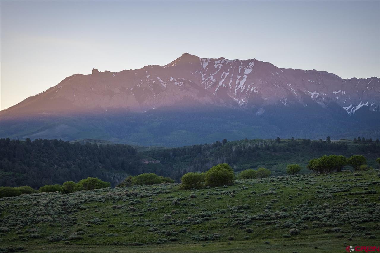 This is a rare and unique opportunity to own the Renegade Ranch, a true western sanctuary just 25 minutes to Telluride. The property is comprised of a vast landscape including Aspen groves, giant Ponderosa pines, meadows, seasonal ponds, and much more. Explore the caves where Butch Cassidy and the Sundance Kid hid out in the mid-1880's on their way to fame and fortune. Spend years wandering the 602 acres from leopard creek below, onto a wildflower meadow with panoramic mountain views, and continue up to your private mountain top for 360 degree views of the surrounding area. Bask in the sunny fields amidst the herds of native elk and reminisce about the way life used to be listening the bells of grazing sheep during the summer months. Wildflowers, expansive views, historic structures and miles of roads and trails all for you. Please call to learn about this exceptional offering!