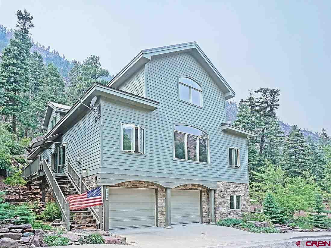 Incredibly well built and appointed home in Ouray Colorado. Built by and for an engineer. The bones are concrete and steel. The interior is Cherry cabinets and built- ins, granite counters, and tile. The exterior concrete siding. See the world through huge windows with great views. Very private mountain setting yet in town with all City services. The floorplan will appeal to a broad range of people looking to live or invest in Ouray Enter into the Great Room, or if you are dusted in snow the mudroom/laundry room or garage entries will accommodate you. Vaulted ceilings amplify the spaciousness of the open floor plan in the living space and from the office. Private covered patio off the master which has two full size walk-in closets, a large soaking tub, a beautiful shower, and his and hers sinks. Mother-in-law unit downstairs with the beautiful landscaped patio out the separate entrance can be rented short or long term or reserved for your friends. Two car garage with all the mechanicals in a separate workshop room. Lots of storage throughout. Property is two lots that have been combined but could be made back into individual parcels. HOA covers road maintenance. This wonderful place comes fully furnished down to the silverware. If you appreciate quality you will love this house. The sellers have lived and worked remotely from here since 2004 and with Fiber Optics now in town this is even easier. As much as they enjoy the home they are looking to begin a new chapter of their lives travelling the world. Schedule a showing, in person or virtually, soon.