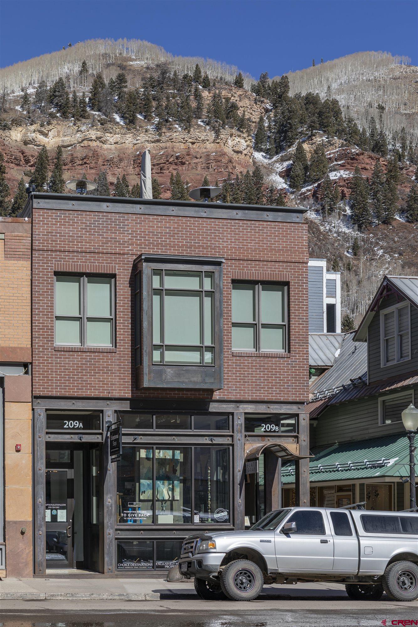 A unique opportunity to own a building on historic Colorado Ave in downtown Telluride Colorado. This 4 unit building constructed within the last 10 years has 360 views from the large patio of the 3900 sqft penthouse condo. Experience the incredible views of of Bear Creek, the box canyon, Telluride Ski Resort, and the Valley Floor. The 4 bedroom luxury 2 story penthouse sits above two high end commercial spaces with solid rental history and great tenants. The building is in the ultimate location for the Telluride downtown area and is complimented with 4 parking spots for added convenience .