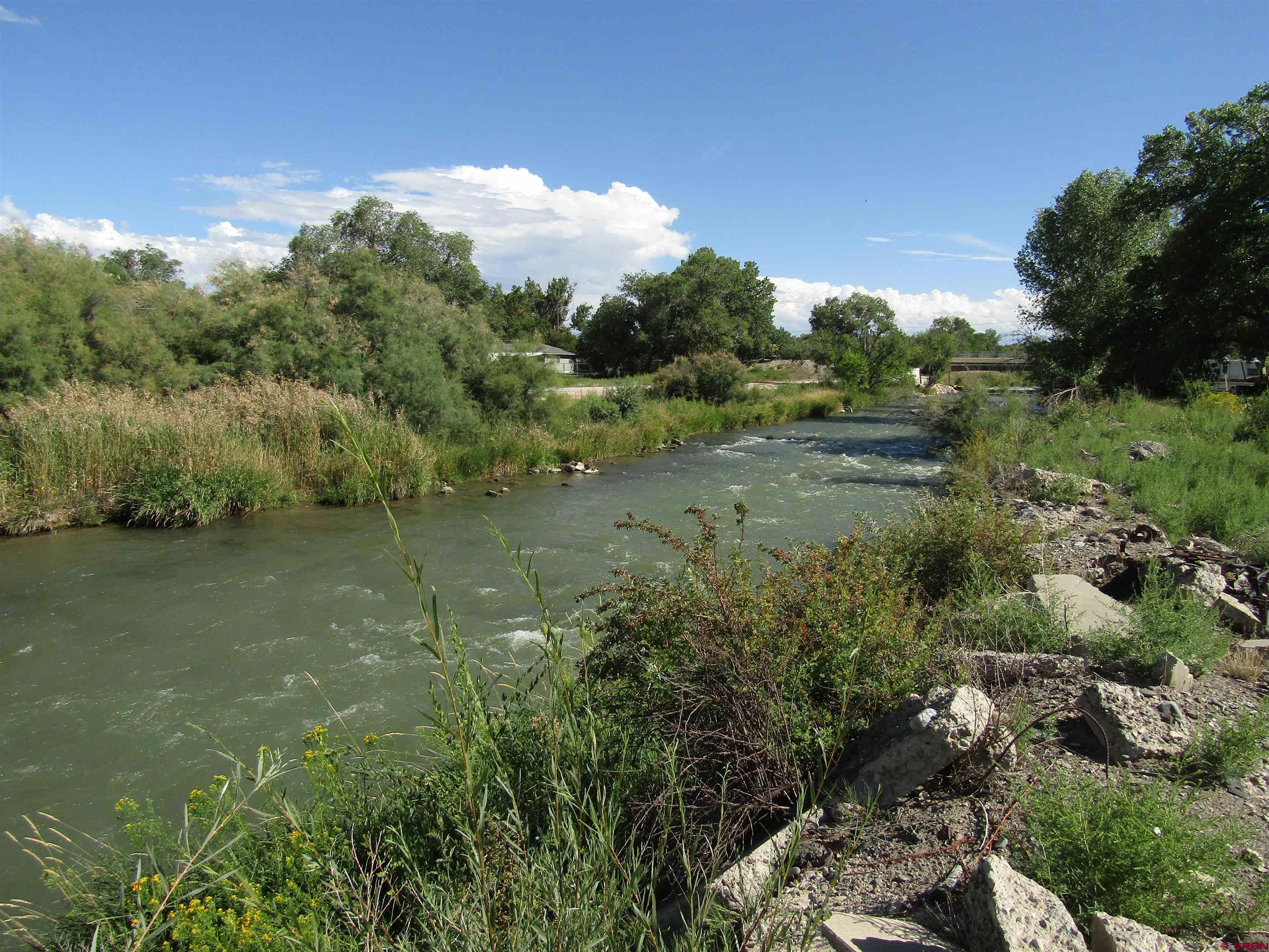This 4+ acres has over 900' of Uncompahgre River frontage.  Located just west of Montrose, this area of the river is designated gold water fly fishing.  Rivers development potential with possible connectivity to Mayfly development North and to the South Montrose water & kayak park.  The development possibilities are endless!  This is the last piece of the puzzle on the river.