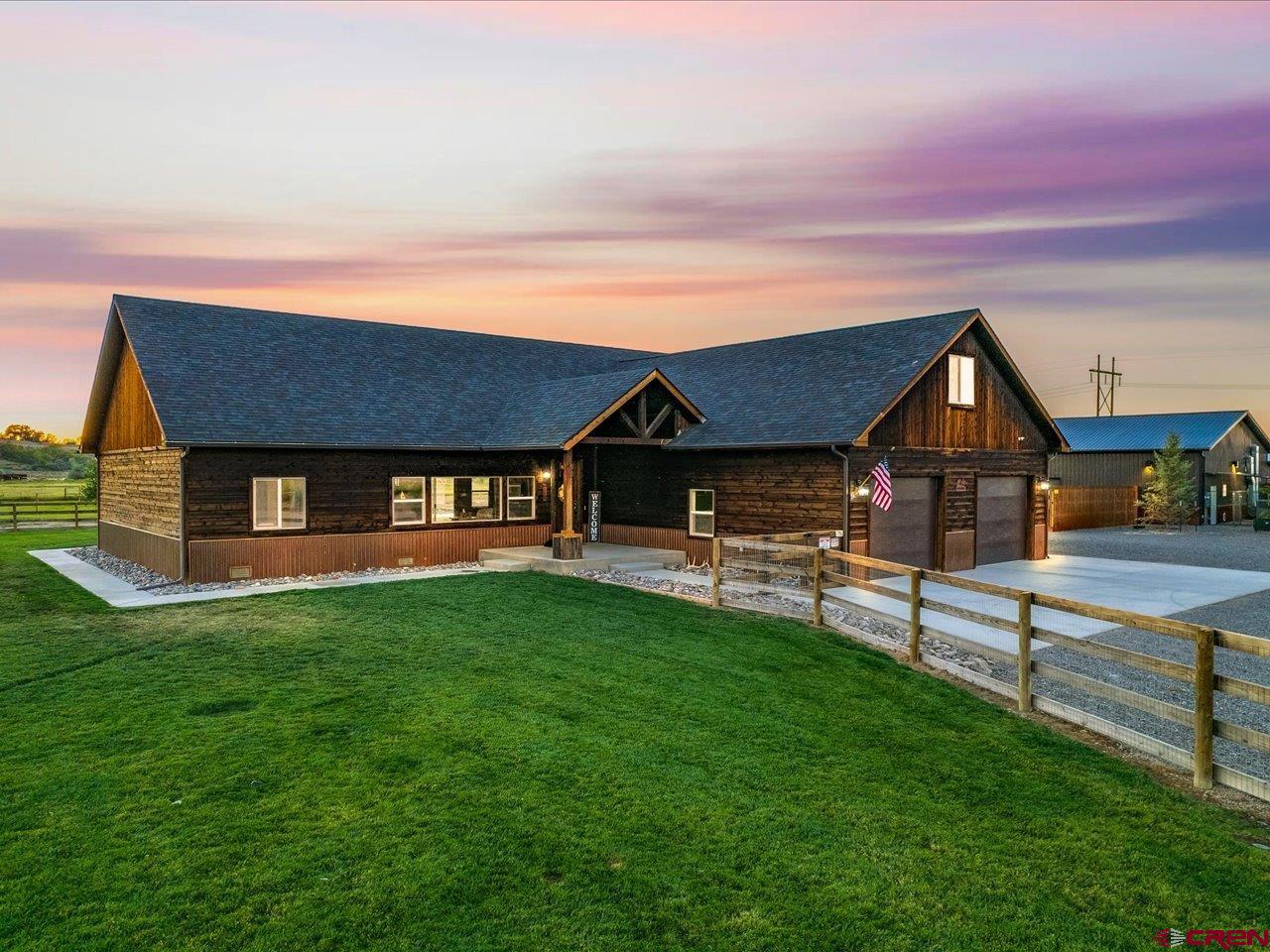 An exquisite home on 4.96 acres with views AND an established Dog Boarding Facility. An amazing opportunity to live and work all at the same  location. The Iron Will Dog Lodge was created in 2014 and has become one of the most elite Dog Boarding facilities on the Western Slope. Iron Will Dog Lodge is a very steady and Lucrative Turn Key Business, with the opportunity to double the size of the clientele with an additional 3200 S.F building already in place. The Real Property and the business are being Sold as a complete package, this includes a beautiful custom home with 2872 S.F, 3 bed, office,  2 baths, bonus room above the 2 car garage, vaulted ceilings, 8' stained alder interior doors,  mountain views and so much more. The Kennel 1800S.F and the detached garage/Shop has 3200 S.F with an RV Bay, additional 2+ car parking area and endless possibilities.