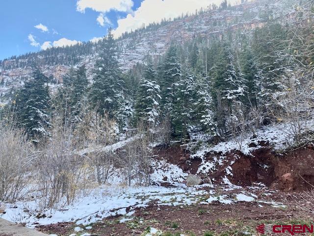 So many possibilities with this rare piece of land located in beautiful Ouray, CO - known as the Switzerland of America! Build your mountain dream home to be your permanent residence, 2nd home, or possible vacation rental.  Maybe you are an investor looking to maximize the space with a 4 plex - this R-2 zoned land allows so many possibilities.  Located on a very quiet, private street, this spot has it all, including mountain views.  One street over lies the famous Uncompahgre River trail making it a perfect location for a walk or cross country skiing/snowshoeing.  One can even take this trail into town (1 mile) and enjoy all the natural beauty along the way.  In addition to the river trail, the property is steps away from hiking trails allowing a person to never have to drive to get out and explore the surrounding mountains.  The Seller has preliminary drawings for a single family residence with an additional living space (extra space for guests, vacation rental, or long term tenant possibilities).  Agent can share these plans.  The Seller also has a rock fall mitigation plan from an Engineering Firm who completed their study on the property.  Seller will be following this plan with the installation of a rock fall berm at their expense.  This work will take place Spring 2022.
