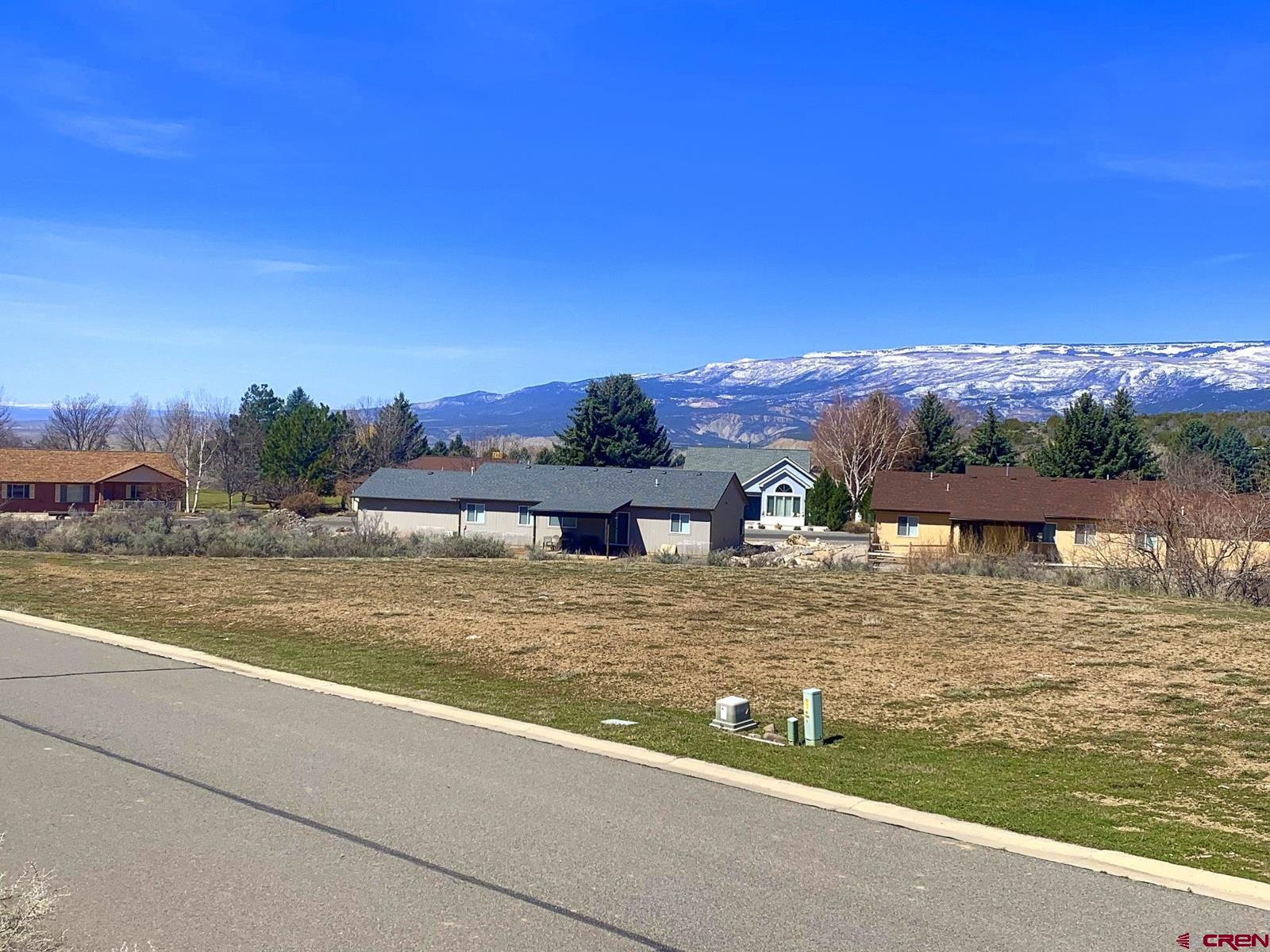 Surrounded by the beautiful Grand Mesa, this desirable lot located in Deer Creek Village is ready for your custom home!  A seasonal stream at the back of the property and an undeveloped hillside across the street allows for enjoyment of nature.  Nearly a half acre lot with good grade for your building site.  Electricity and fiber optic cable are near lot line, with water and sewer taps available.  Walking distance to Cedaredge Golf Club and Lucky Shot Bar & Grill.  Conveniently located to the town's amenities, including Surface Creek walking trail, grocery store, gas station, restaurants and downtown shops, as well as Grand Mesa Arts and Events Center, plus year-round recreation on Grand Mesa.  It's easy to fall in love with this area.  Come on home!