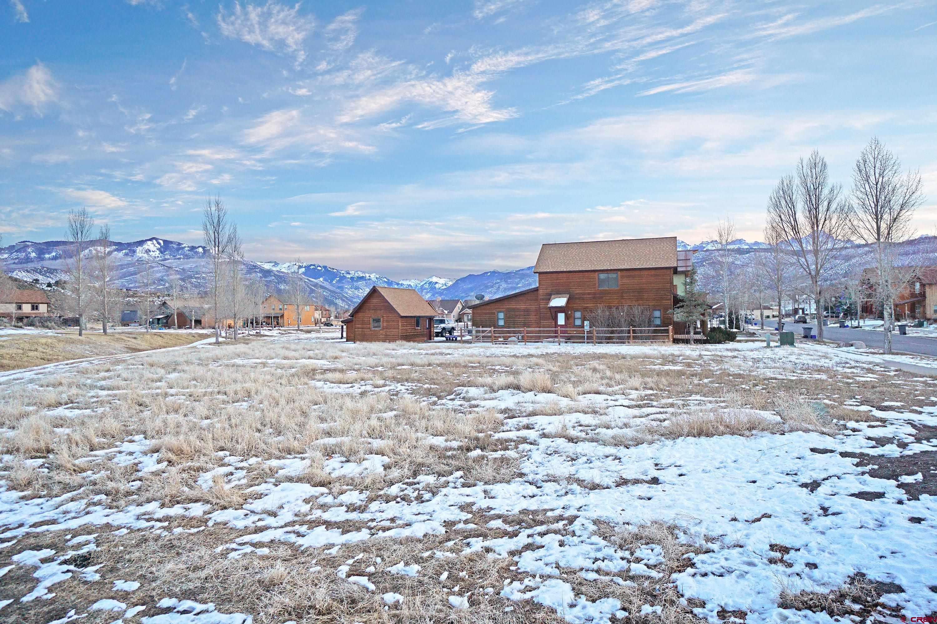Incredible duplex lot with great views in River Park!  Views of the San Juan Mountains including Mt. Sneffels clear down Ouray Valley and Abrams Mountain!  Numerous building options for the buyer, including single family (buyer to verify with Town of Ridgway, County, and HOA).  The property backs up to open space.  Lightning quick fiber optic internet from Clearnetworx is currently in the works for the entire area.  To top it off, $5160 has already been paid towards the water tap and $6020 is pre-paid towards the sewer tap.  Buyer will need to verify balance to be paid for each with the Town of Ridgway as there are numerous possibilities/configurations depending on what they are building.  If you enjoy beautiful scenery, outdoor activities, and friendly people, your search is over. Recreational activities abound in the area. Ridgway State Park which has great boating, fishing, and camping is located about 5 minutes away. Telluride and its exceptional skiing is a short 45 minute drive. The mountains are well known for their stunning vistas which can be reached by 4WD or hiking for the more adventurous. There is also biking, rafting, camping, fishing, hunting, and a host of other activities. Ridgway is still a small town with some of the friendliest people you will ever meet. There are plenty of great eating establishments, art galleries, and cultural activities to keep everyone entertained. Montrose is located only 30 minutes north which offers about anything you will ever need. They have one of the top rated regional hospitals in the country, regional airport, Home Depot, large grocery stores, Walmart, and numerous other national and local businesses.