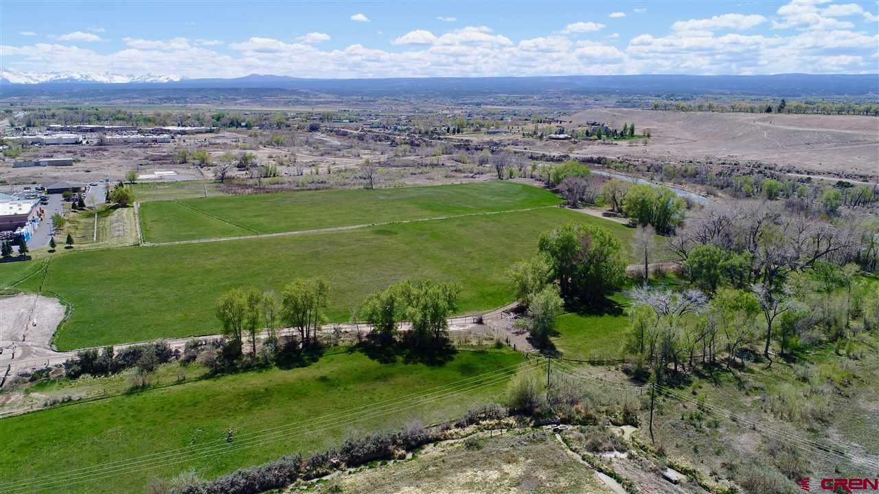 Here it is, one of the last commercial development opportunities in the hub of Montrose! This listing is for Lot 4-C which is 2.37 acres. There are (8) parcels for sale, all listed separately. These prime B-2 zoned parcels are off of the future 100 ft Rio Grande Avenue and the Ogden Road extension, which will play a key factor in giving frontage to these parcels. Take in the Uncompahgre River to the west, the beautiful San Juan Mountain Range to the south, and the new bike paths which will provide both road and foot traffic. Flat, usable parcel with gravel on site which can be crushed and used for roads. This is potentially a huge cost savings. Located near the signaled intersection of South Townsend and Ogden road, this property has excellent exposure and is easy to access. This is a prime location close to City Market South, Walmart Superstore, next to Home Depot, Target, Marshall's, Natural Grocers, Golden Gate Gas Station and the new Montrose Rec Center. One of the last prime development properties close to the river in the City of Montrose.
