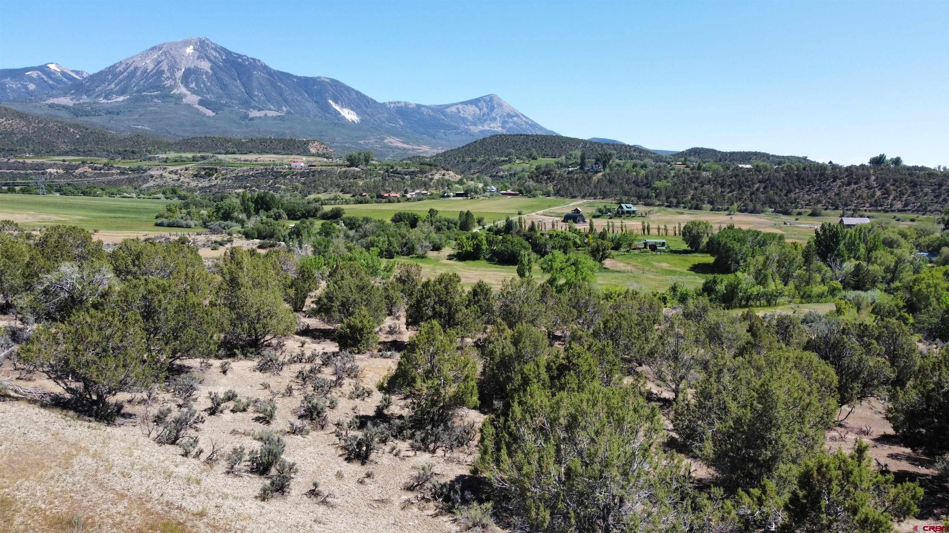 One of a kind parcel on the edge of Paonia! Located adjacent to BLM / Mt. Jumbo trails with full, unobstructed mountain views, this is an exceptional opportunity.  Access is via Hawk's Heaven road but this is outside of the subdivision. Offering senior irrigation rights, a municipal water tap, and room for horses with riding trails right out the gate. End-of-the-lane privacy,  the parcel is part of a conservation easement limiting building to within a three acre envelope with few other restrictions.
