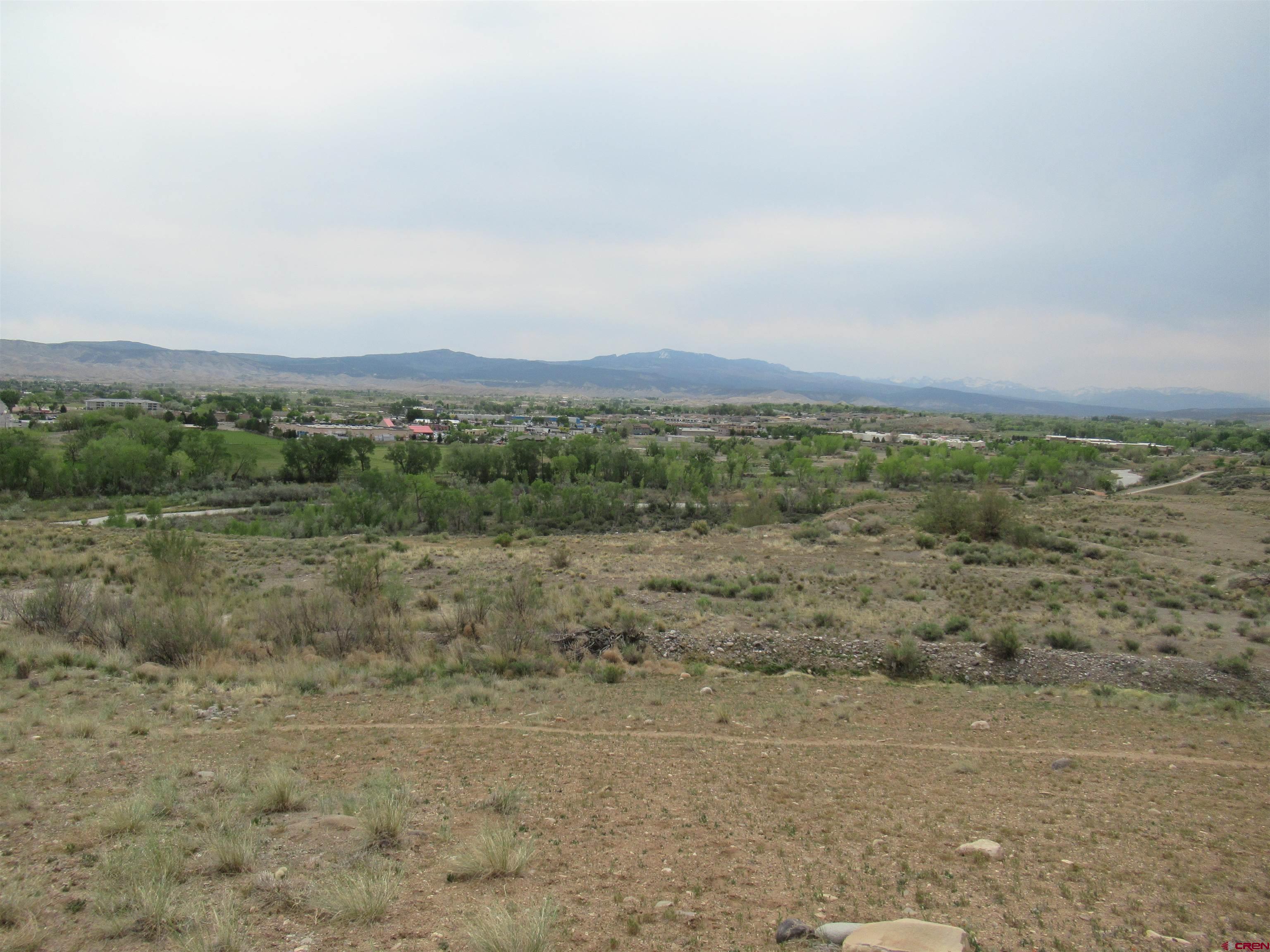 Beautiful Terraced Overlook with Panoramic Views!   33.14 Acre Residential Development Potential.    Impressive parcels, totaling 33.14 acres (MOL) in the City of Montrose. Property is zoned R-3A, which can be both Single Family and/or High-Density development. Development includes 2 parcels. Property is located near Sunset Mesa Youth Sports Complex. Excellent investment/development potential. Just minutes away from booming South Corridor: Home Depot, Target, Hobby Lobby and Walmart on Townsend/Highway 550. Gorgeous views of the San Juan Range and Uncompahgre River.     This listing also includes Parcel # 3993-053-14-002/R0024823. The property is split between the City of Montrose water district and the Chipeta water district.