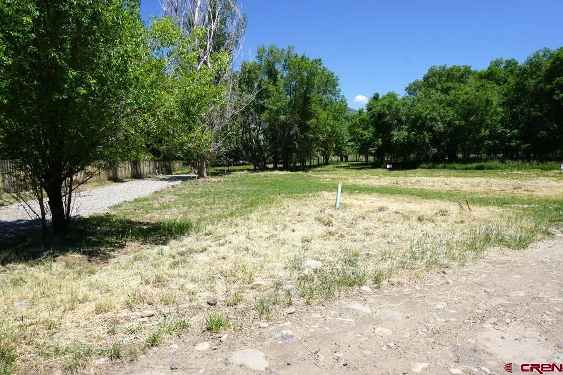 Desirable Paonia building site!  This bright property is located across from the North Fork of the Gunnison River and a short walk to town.  Its ready to go with an R-2 zoning, domestic water, irrigation water, and sewer.  Come enjoy the peacefulness and birds singing while you design your new home.