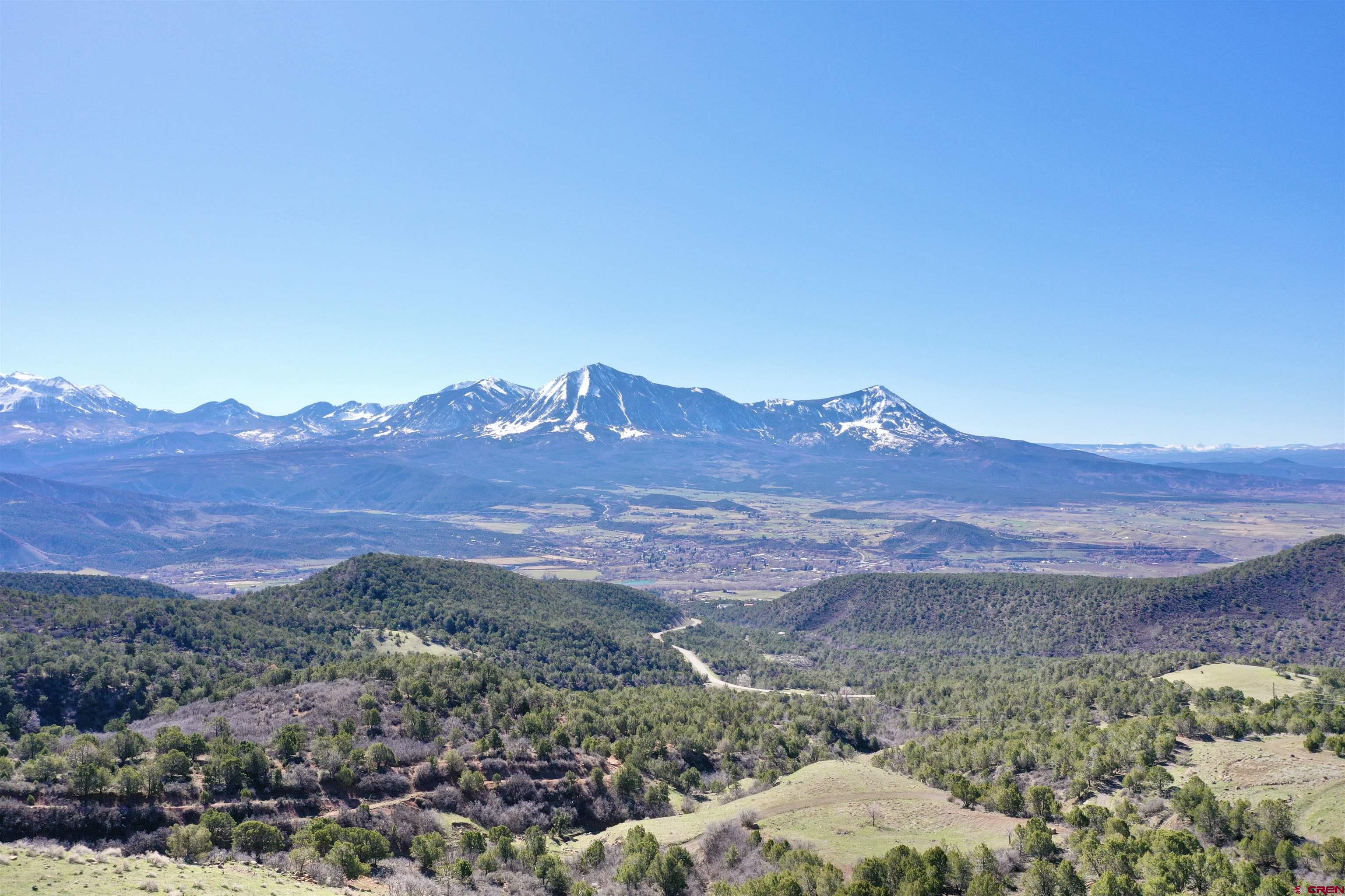 Come be inspired by this incredible 120 acre enclave perched above the picturesque town of Paonia, CO. This property has boundless potential- whether it be a stunning custom home site, a solar farm, a new development, or simply a place to retreat from the everyday world, this is it. The sloping topography varies from steep to rolling hills, and there are numerous park-like benches that would make incredible building sites. There is not a spot on the property that doesn't highlight the massive North Fork view of not only Mt. Lamborn and Mt. Landsend, but also of the entirety of the West Elks, the Ragged Wilderness, and even down to thee stunning San Juans. Meander just 5 minutes up the paved Stevens Gulch road to a private gate to access the property. It is surrounded on all sides by BLM. This provides wonderful privacy and access to public lands. Rich in history, this property was once the site of the Westmoreland Mine, and has since been thoroughly reclaimed. There are so many options for the future of this property, and there is nowhere that provides such awe-inspiring views.