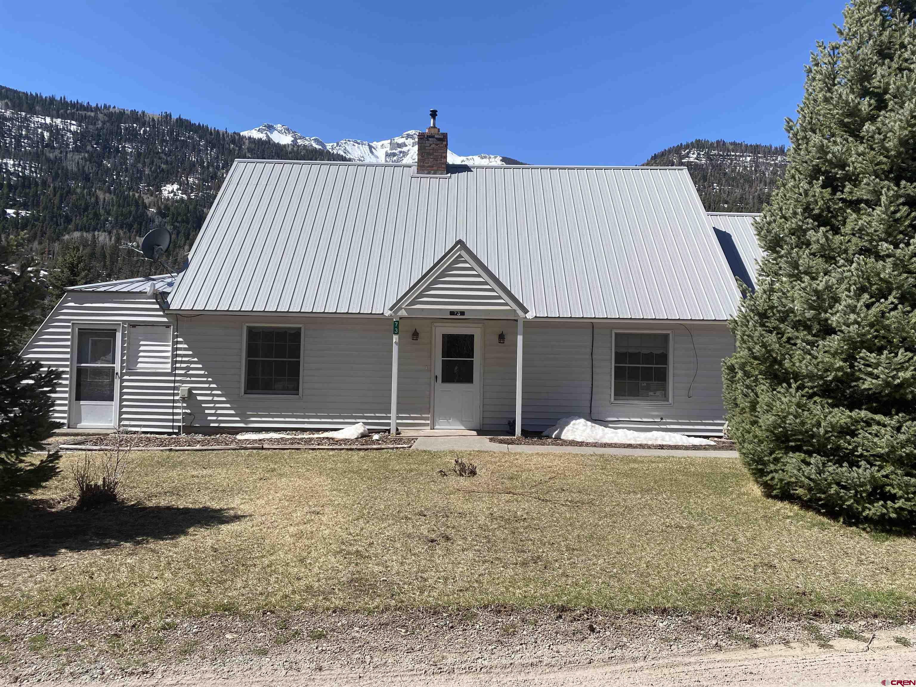 ***Property is back on the market to no fault of the Seller - Buyer was unable to perform*** This 3 bedroom 2 bathroom home is within the city limits of Ouray City, with unbeatable views of the mountains and Ouray.  When walking through the home, the main level consists of the kitchen, living, laundry, 3/4 bathroom and 1 bedroom, with a mudroom servicing the garage and back porch. The kitchen boasts a gorgeous red brick wall giving the space a unique accent.  There is also a spacious sunroom, perfect for creating a special nook amongst the plants.  Heading upstairs there are 2 bedrooms with great views of the mountains and 1 bathroom in the hallway. There is an attic that has an abundance of storage space, which is accessed through one of the upstairs bedrooms. There also is an additional non-heated room off of the mudroom, which could be used for all sorts of storage.  The yard is a great place to sit on the back deck and enjoy the crisp mountain air and views of Corbett Peak.  Make this home yours and enjoy the fireworks during the 4th of July and New Years celebrations!