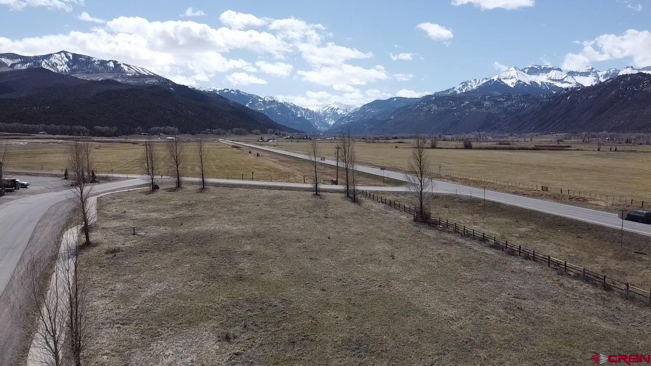 Highly visible commercial lot in Ridgway fronting Hwy 550. Exception views from this special property.  Adjoining property also for sale-see listing #792487.   Accessible via County Road 12 (off Hwy 550) or Hunter Parkway (Zoned: General Commercial)