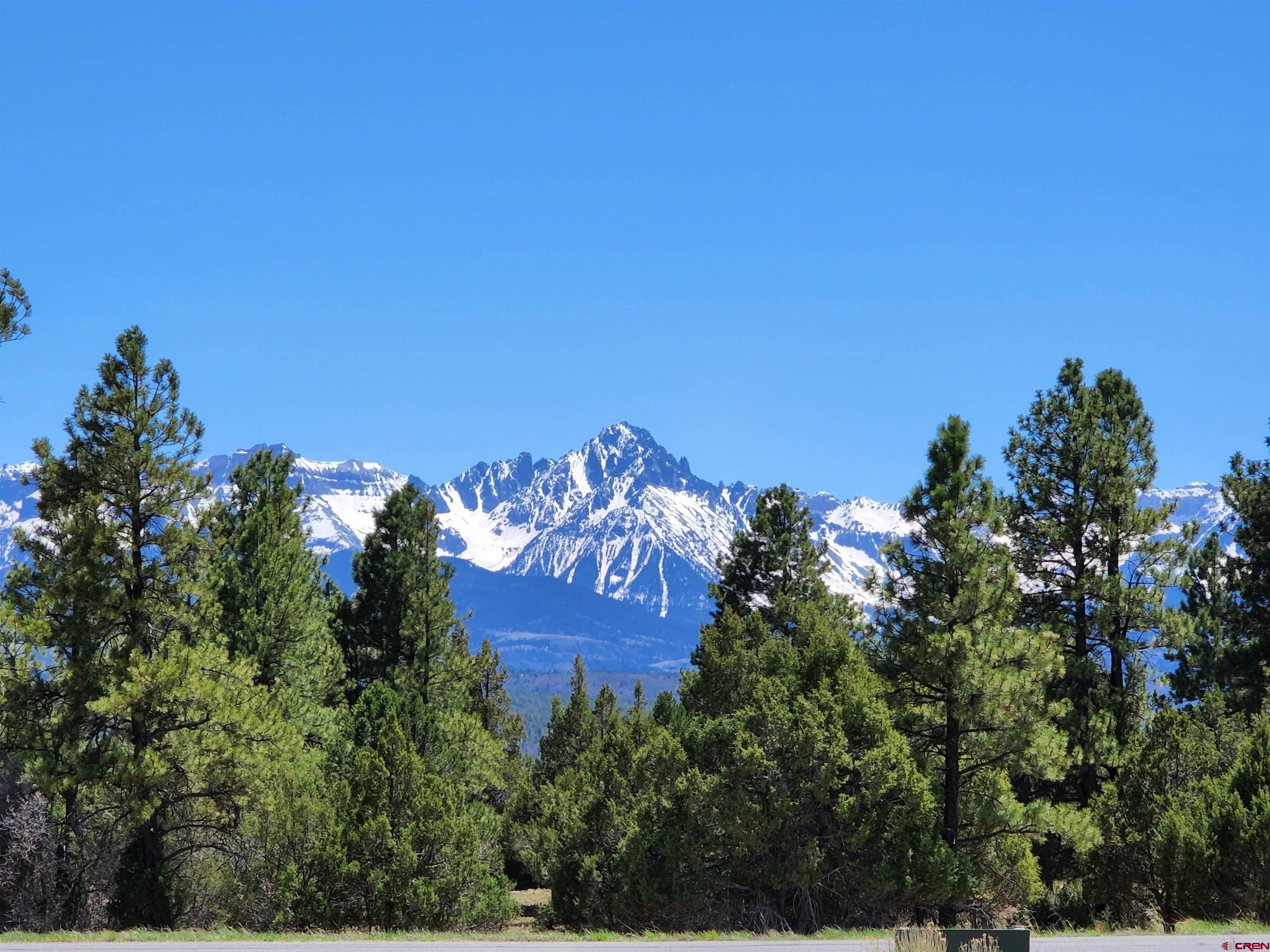 This property has the option for a custom-built residential home with spectacular views of the Divide Ranch golf course and the San Juans & Cimarrons mountains in one of Ridgway's most sought after neighborhood of Log Hill! This commercially zoned parcel captures a "direct shot" of Mt. Sneffels. Adjacent to a vast amount of open space, you can create your commercial venture, or a spectacular residential home with the approval of Ouray County Planning & Zoning on this amazing parcel. The possibilities are endless: wedding destination, lodging, brewery, distillery, or restaurant  Live, work and play!   This property is minutes from downtown Ridgway, Ouray, Telluride, Montrose airport, skiing, festivals, climbing, jeeping, hiking, boating and flyfishing.  So many outdoor adventures at your fingertips.