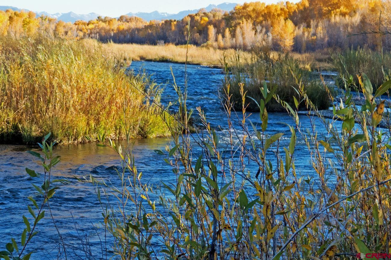 The Sweetwater Ranch stretches along 1.3 miles of the Uncompahgre River, just south of Montrose, Colorado. This 228± acre paradise boasts over ninety irrigated acres, multiple duck ponds, and private river frontage, all within Montrose's growth corridor. Lowland forests, dominated by mature cottonwood trees, harbor trophy mule deer, and frame a marvelous view of the San Juan Mountains. Concerning natural attributes, the Sweetwater Ranch is truly unrivaled in Montrose County.  Complementing its innate value are substantial improvements. Over $200k was recently invested in irrigation infrastructure to fully utilize the water rights provided through UVWUA. Additionally, two 2,600+ SQFT homes provide living quarters and potential rental income. The Sweetwater Ranch, one of the largest riverfront properties in the region, is simply irreplaceable and truly a must-see valley ranch.