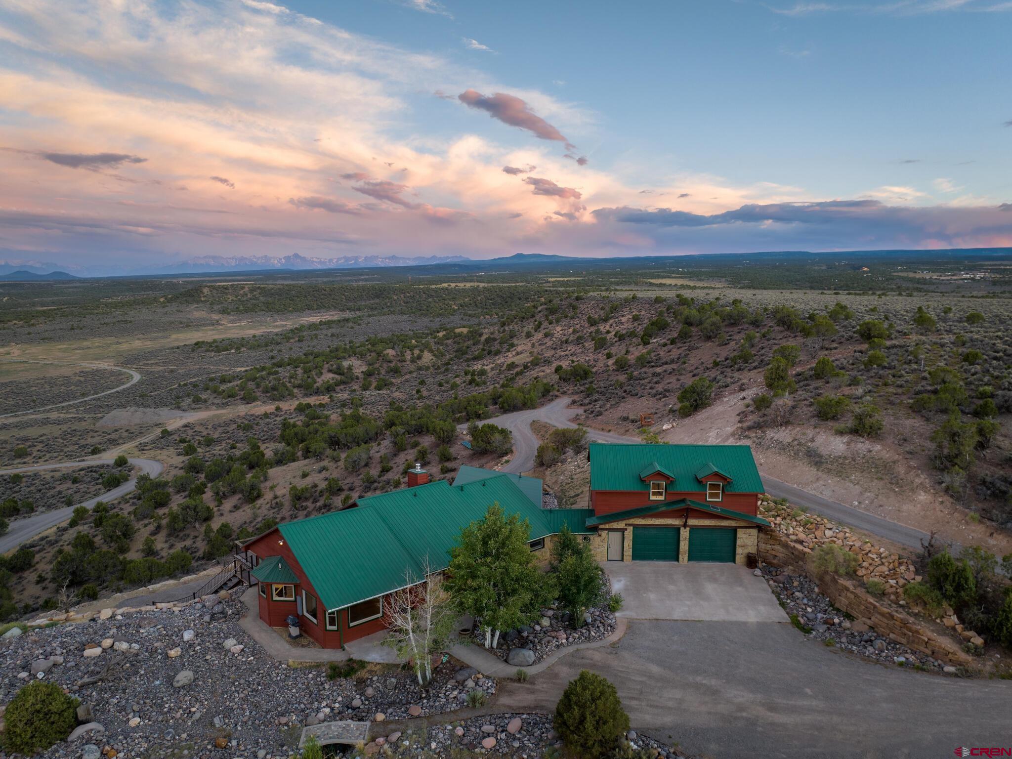 This home has truly some of the most spectacular views you can find within 10 minutes of downtown Montrose.  Very private.  Views from Sneffels to the Grand Mesa and evening lights of downtown.  15 private acres that border over 120,000 acres of BLM lands to the southwest. Calling all pilots! Tucked into a private valley with an airstrip and large acre homesites.  The home was a complete remodel in 2022 and is being sold unfurnished.  There is a large Shop/RV storage/workshop.  Loads of parking and land for further use.  The home has ample storage, a couple of flex rooms for a studio, game room, etc. Truly a must see for the Buyer looking for one of the finest homes in town and flexibility to create your family program on site.