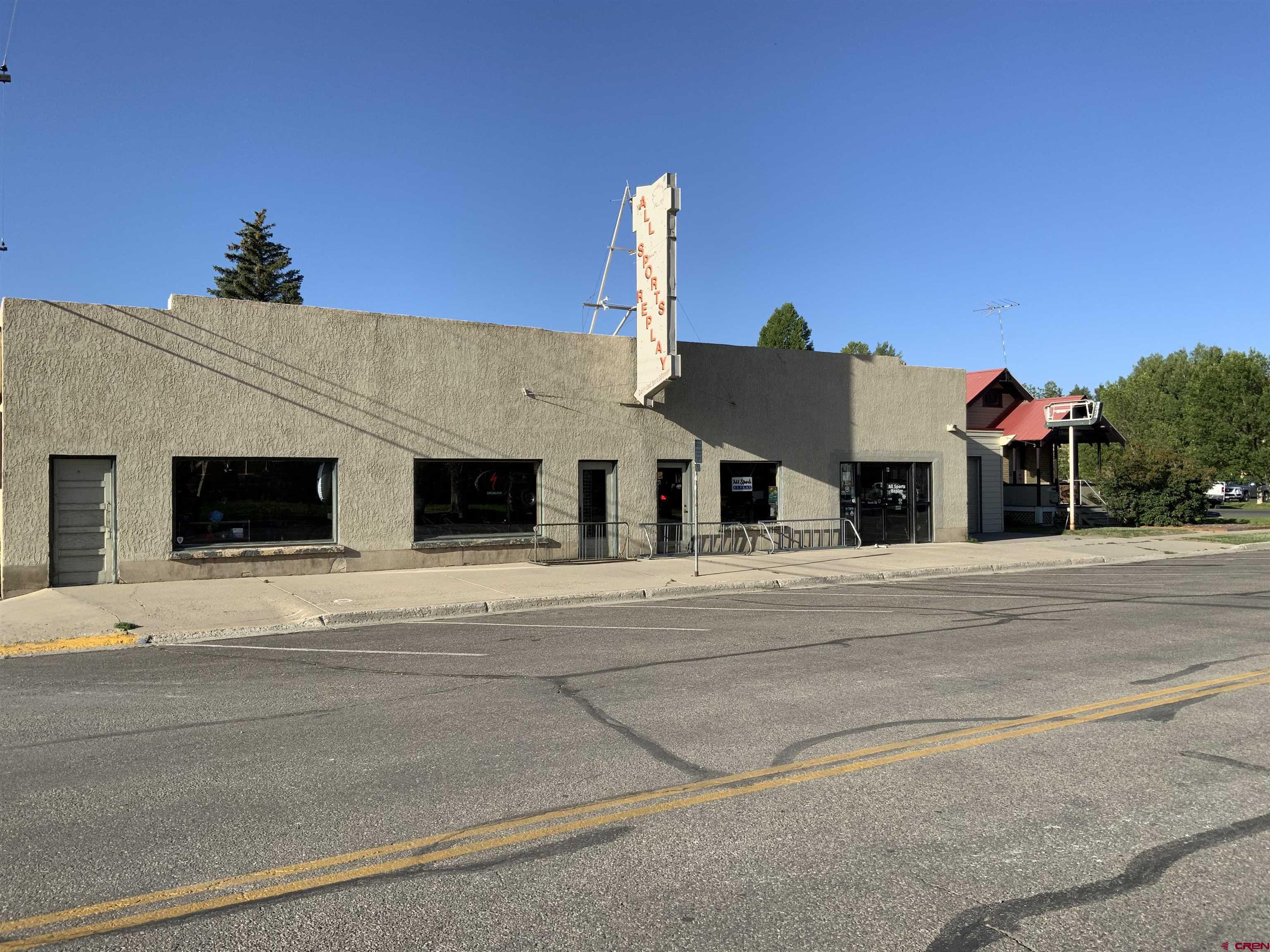 Great opportunity to own a commercial building in downtown Gunnison along with a fun and profitable sporting goods business.  All Sports Replay has been in business since 1996 and offers new items, consignment items, bike repair, full service ski maintenance (base grind, waxing and sharpening) and ice skate sharpening.  Building is 6,468 square feet with two restrooms, one dressing room, an office and an attached garage bay for storage.  There is a 7' x 8' garage door off the alley for deliveries into one of the extra storage rooms.  The ski shop side also has two restrooms.  Outside fenced in storage at the back of the building as well.