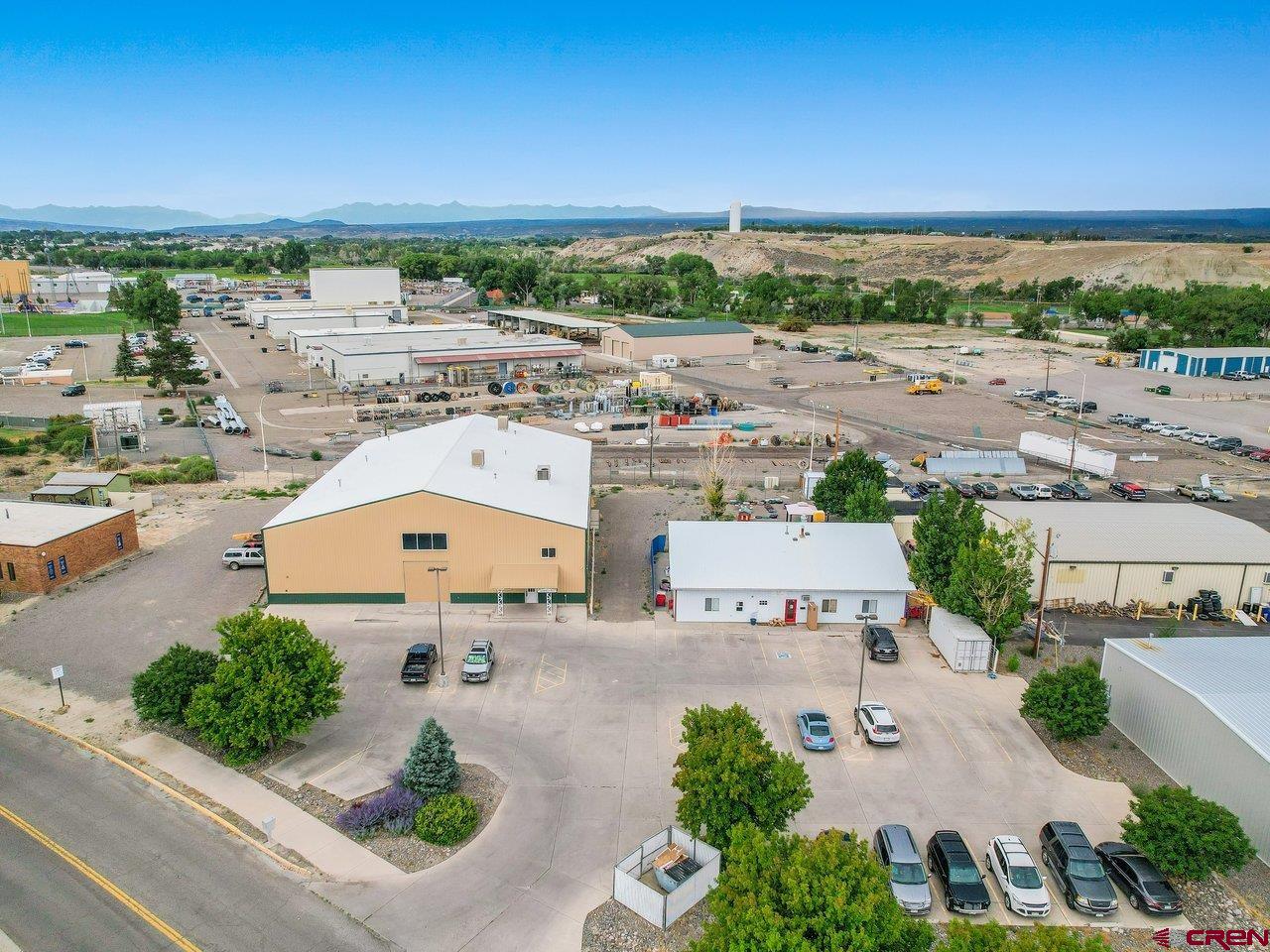 Two buildings totaling 15,850 square feet on 1.13 acres zoned light industrial. Both buildings are occupied now on short termleases. The property is located near the new Colorado Outdoors development. Showing by appointment only - do not disturbowner. Contact agent with questions and to set appointment.