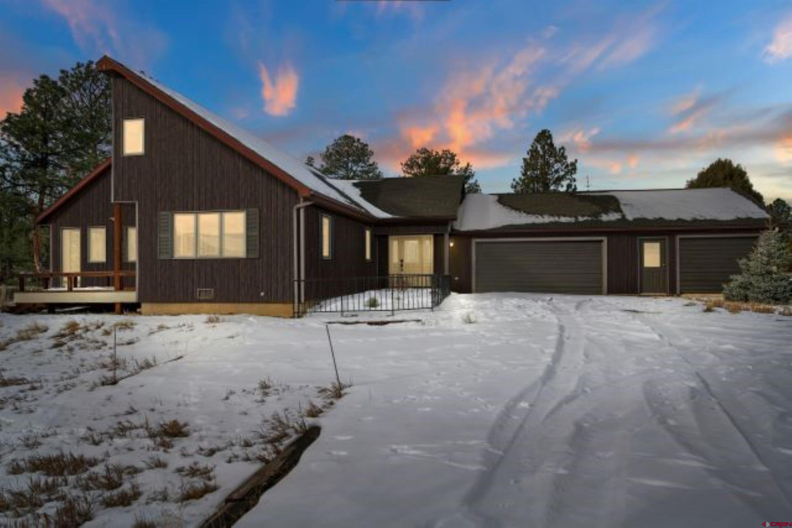 A spacious, low maintenance home on a superb drop-away lot. With 4 Bedrooms and 2.5 Baths there is room for all your projects. With some thinning of the downhill trees, the primary view could be shifted to the Sneffels Range. Historically the home favored the Cimarron views from the breakfast room, but both mountain ranges are visible from the 1st and 2nd floors.  An Indian Pointer Tree in the back yard directs you towards Orvis Hot Springs. The homesite is relatively level, then the lot rolls-away to the Open Space below and the neighborhood hiking trails. Gracious porches plus a gazebo provide plentiful outdoor entertainment space. An attached greenhouse, and an ancillary hot room provide protection from the numerous creatures including, deer, squirrels, etc. The heated shop is also an extra garage. A walk-in attic space adds to the storage. The home has not been lived in a number of years, the kitchen could use a refresh/update. Sub-floor hydronic heat was added when natural gas became available. Fiber Optic conduit is already at the street for your home office.