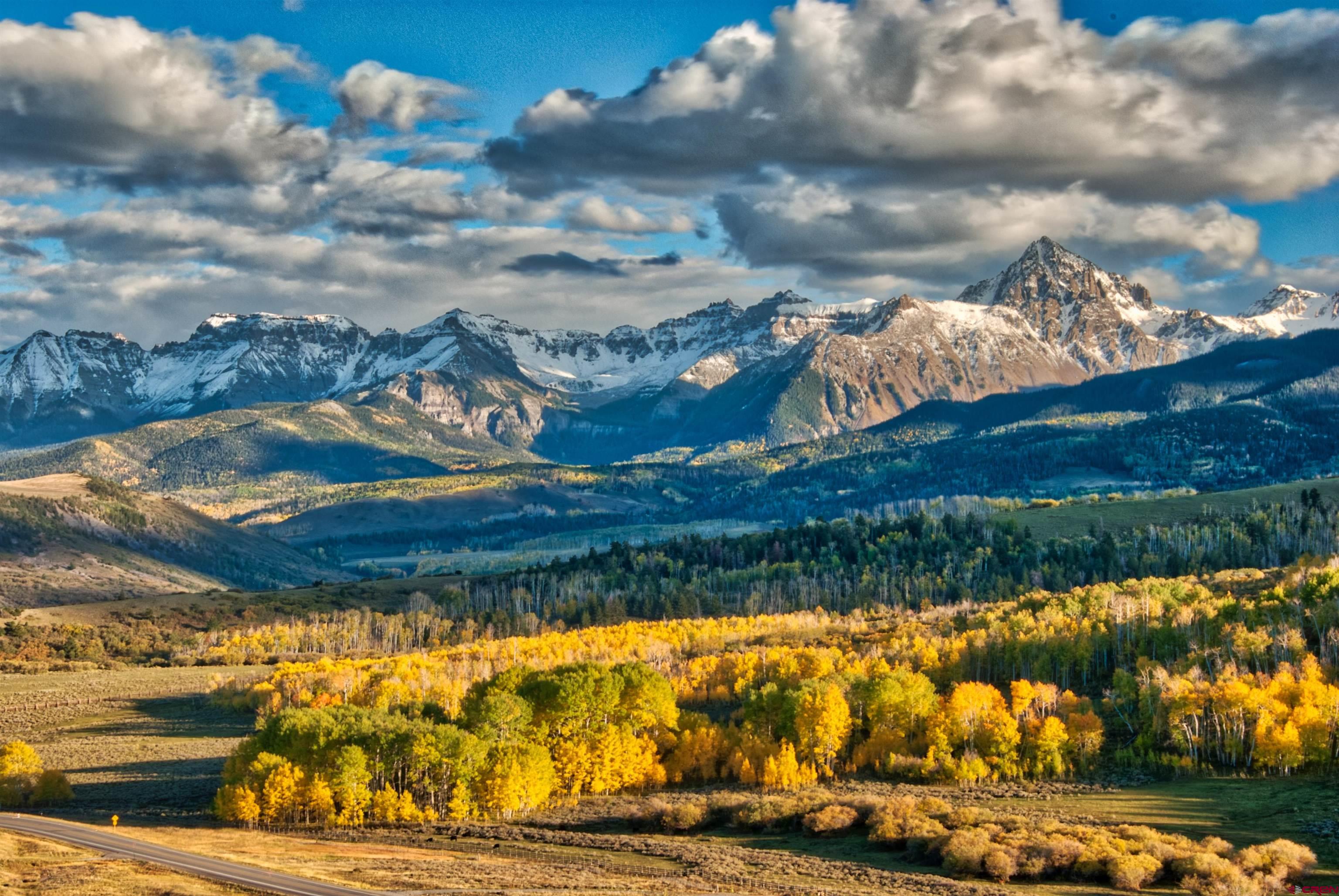 Looking for the ultimate in privacy, security and the best views on Colorado's Western Slope? Here it is! Located at the very top of the iconic Dallas Divide! Colorado Life magazine (September/October 2016) named Snow Drift Ranch on the Dallas Divide as the number one location in the entire State of Colorado to view Autumn colors. Secluded and very private yet has year round access along Colorado Hwy. 62. 15 minutes from Ridgeway and just 35 minutes from Telluride. The home was built in three phases and is truly an engineering marvel. On grid plus there is a total self sufficient off grid option.  This home has so many great features that it would take hours to explain everything. Breathtaking views, comfort and convenience in any event with accessible seclusion. It has everything including a state of the art security system. This gem could easily become a first class equine facility with ample acreage for barns, an arena and pasture. If hunting is what you desire Elk and Mule deer frequent the property and over the counter Elk tags can be bought annually. With the famous Double RL Ranch across Hwy. 62 allowing extremely limited elk hunting, this makes hunting on the Snow Drift Ranch extremely good. Skiers and golfers have the best of both Worlds! Telluride with it's World famous skiing, dining and shopping is just a short drive away and the Divide Golf club which offers memberships and is open to the public is minutes away from your front door! And of course Ridgeway being just fifteen minutes away has it's offerings, shopping, farmers market, festivals and Rodeos to entertain the whole family. The amazing home could accommodate a large family and guests or could serve as a corporate retreat/meeting facility.