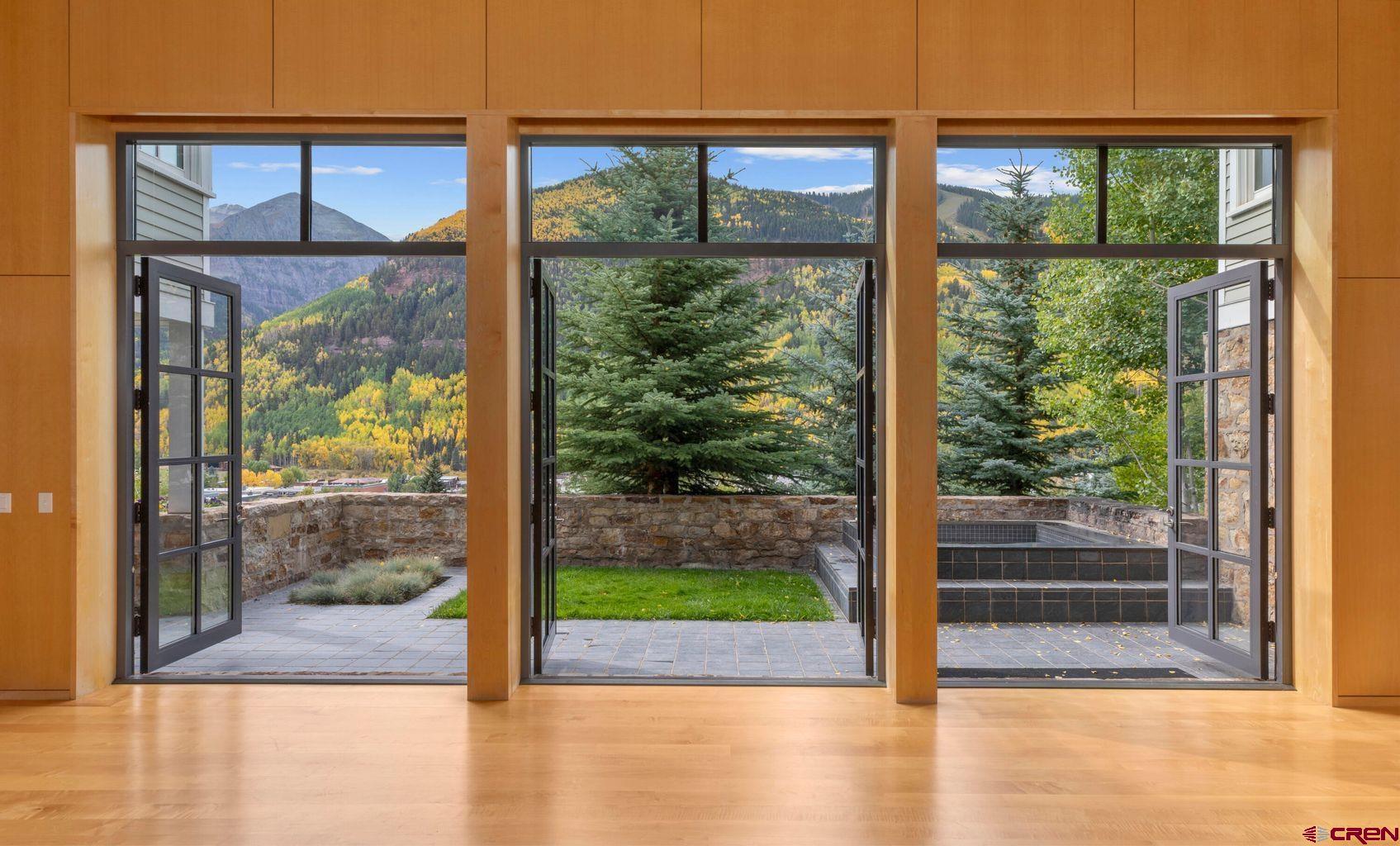 One of the most recognized & sought-after homes overlooking the storybook setting of historic downtown Telluride, this is the first time this wonderful town property has been available for purchase in over 15 years. Perched just above the Telluride Historical Museum on a landscaped bench of land occupying just under a very-rare half-acre, this home has been host to some of the community's most storied gatherings. Vaulted, light-filled spaces open to generous decks & sun-washed terraces with views from the canyon's waterfalls to Bear Creek Canyon, the Telluride Ski Area & out toward the Valley Floor. Between Main House & Guest House, you'll find 8 bedrooms, complemented by wonderful places to gather & entertain. Walk straight down N Oak St to skiing, shops & restaurants