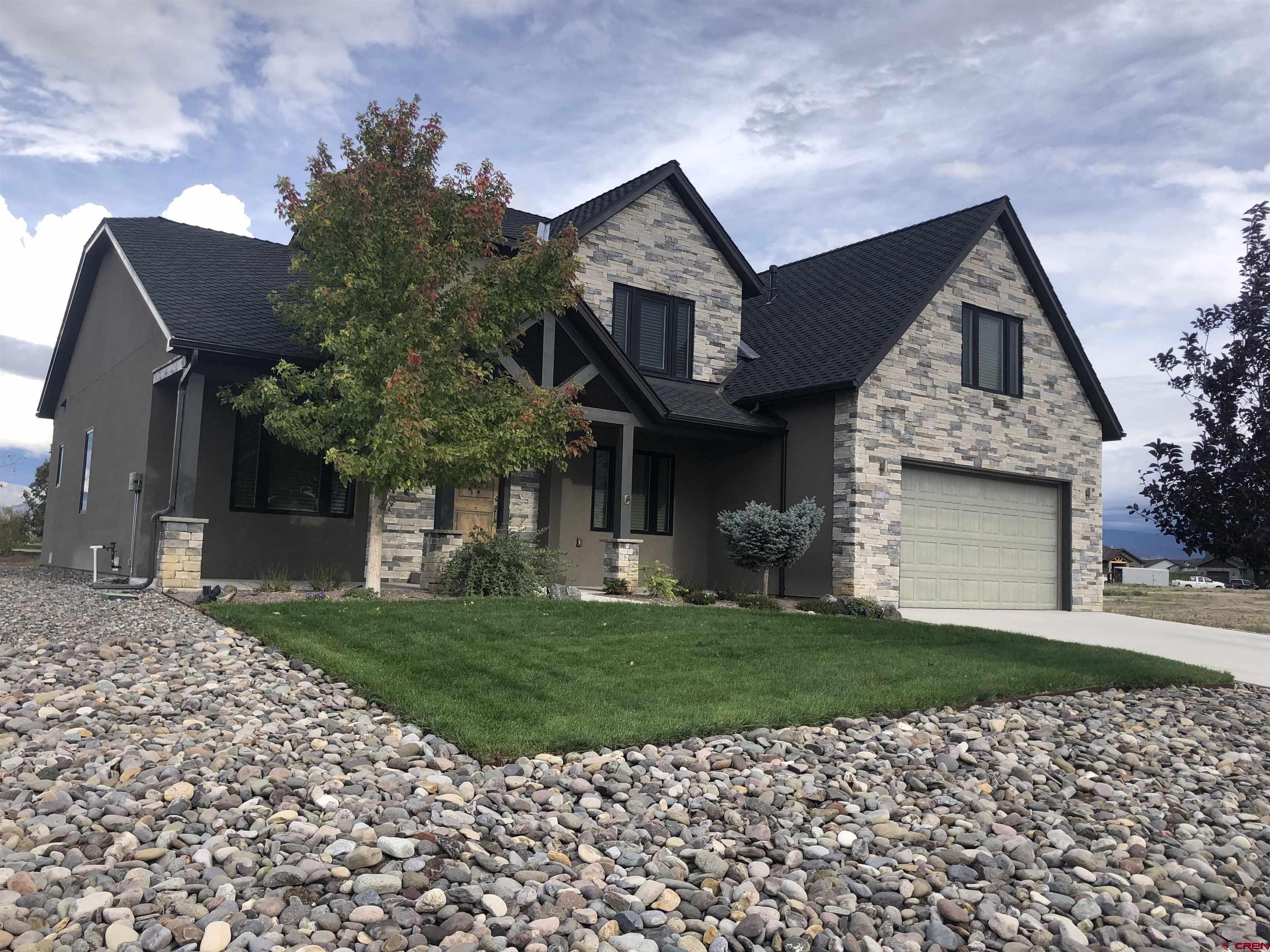 This wonderful home is located in The Bridges Golf Course community, great views! Built in 2016 with beautiful upgrades and kept in immaculate condition. Close to shopping, downtown Montrose and minutes from the Clubhouse and Remington's Restaurant. The Main level design provides for a spacious 17' ceiling, gas fireplace, and views of the golf course and mountains. The kitchen is efficient and features wood dovetail drawers and cabinets with soft close hinges, solid counter surface to cabinet glass tile back splash, recessed lighting. The kitchen eating space offers a bar counter for chairs. This area is located just off the partially covered deck overlooking the landscaped yard before the golf course and mountain views.   The source for all measurements and/or dimensions were obtained from the County records/City record/ utility providers and HOA and are deemed to be reliable and should be verified by buyer and/or agent. All room sq. ft. dimensions are rounded and should be verified buy buyer/agent. The upper bedroom called the fourth bedroom is without a built-in closet and would serve well as an office or playroom/hobby room however is referred to as a bedroom from the county assessor records.