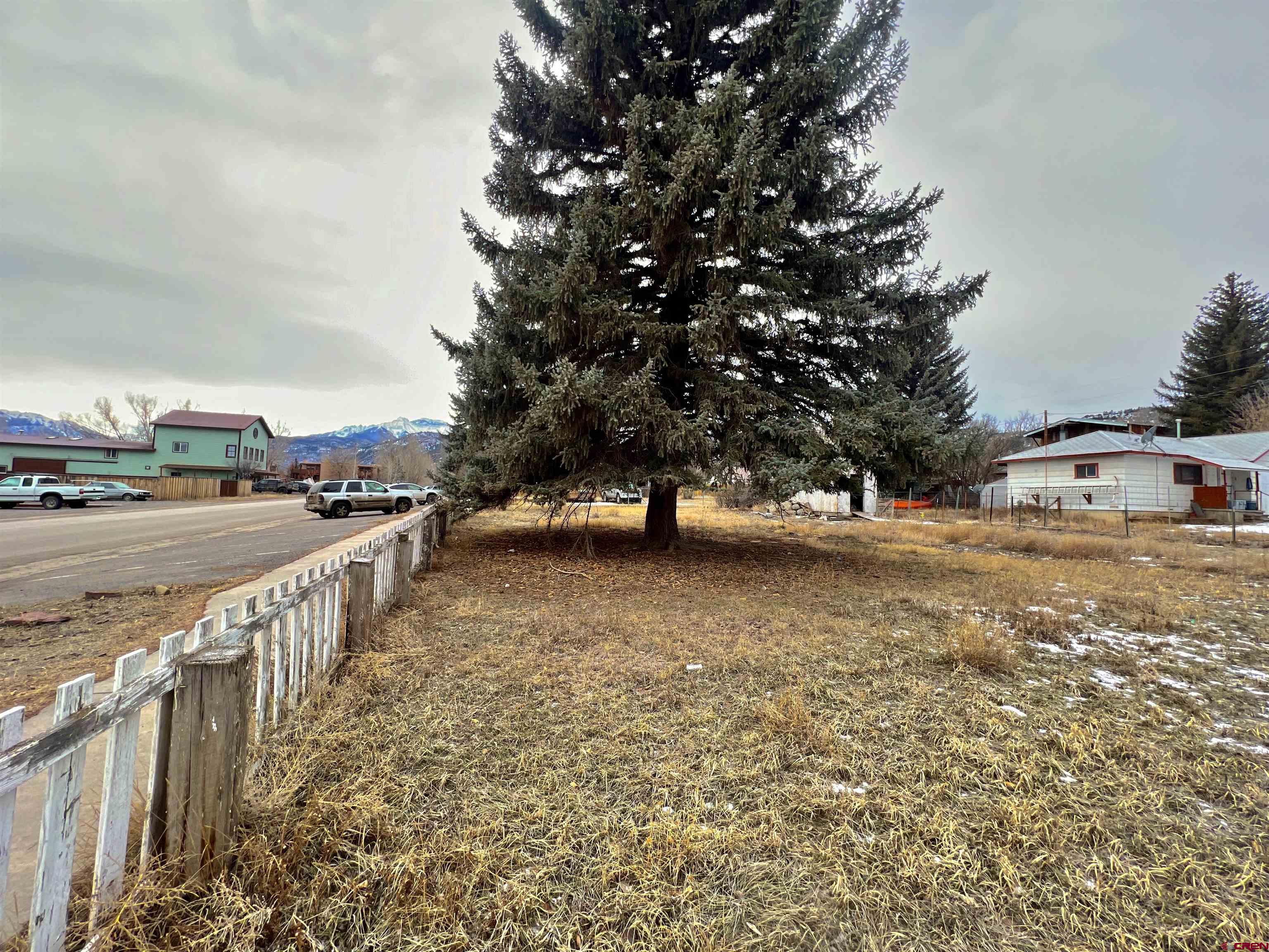 Location is key to this property located in downtown Ridgway! Four lots with current water/sewer taps. This property is priced to sell with the value in the land.  To own this and develop this prime location parcel with Historic Business zoning is truly a amazing opportunity. Would be great for multi-housing units, commercial, retail shops, business offices, service establishments, depots, clubs, theatres, restaurants, hotel, churches, and arts & craft studios! Ridgway is a quickly growing community. Gateway to Telluiride, Ouray and the Colorado Lifestyle.