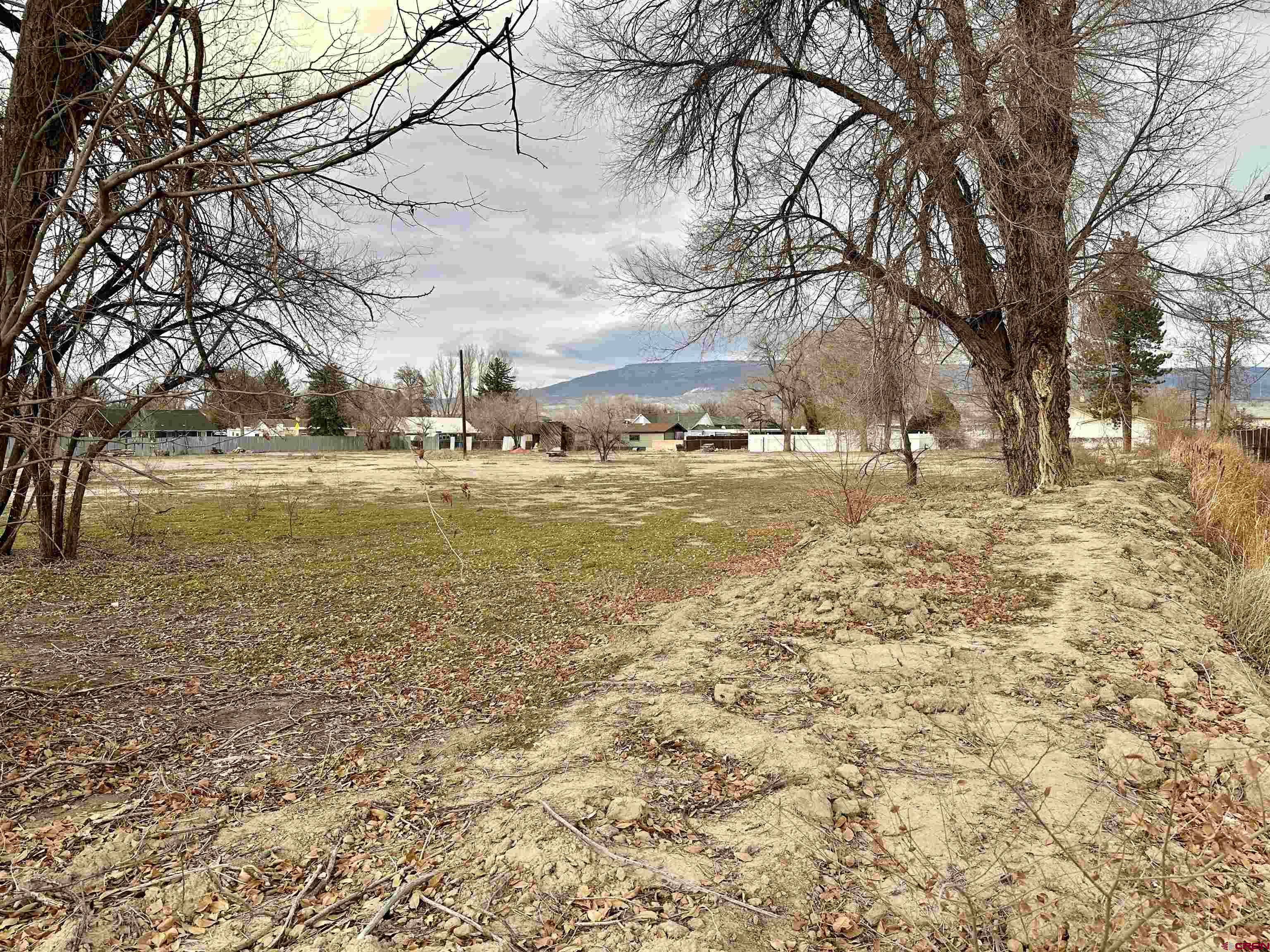 Come take a look at this property that features TWO lots- use them together or separately. At just shy of 1 acre each, these lots would make excellent building sites for either a single family home or a duplex. Zoning is R-2. This property also comes with a City of Delta water tap. Beautiful views of the Grand Mesa! The property is also fully fenced and has 1.8 shares of UVWUA irrigation water. Sitting atop Garnet Mesa, this is an excellent location for those looking to be close to the schools, hospital, and the amenities of town. Come check it out!