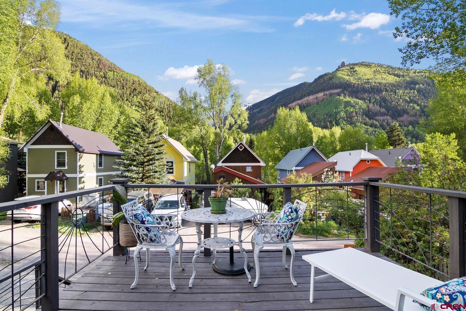 Stunning views of Bear Creek, the ski area. Ajax Peak and the east end of the valley welcome you to this well maintained home in a vibrant East Telluride enclave. The sun soaked vaulted living room, spacious south facing deck and off street parking highlight this three bedroom home. The oversize lot offers additional redevelopment potential without a historical designation to complicate a future development project. (See Documents for an architect's analysis of a maximum potential buildout). Located on a dead end street, only four blocks from town park, assures privacy and convenience. Is it time for Telluride? If so, call me for your personal tour today.