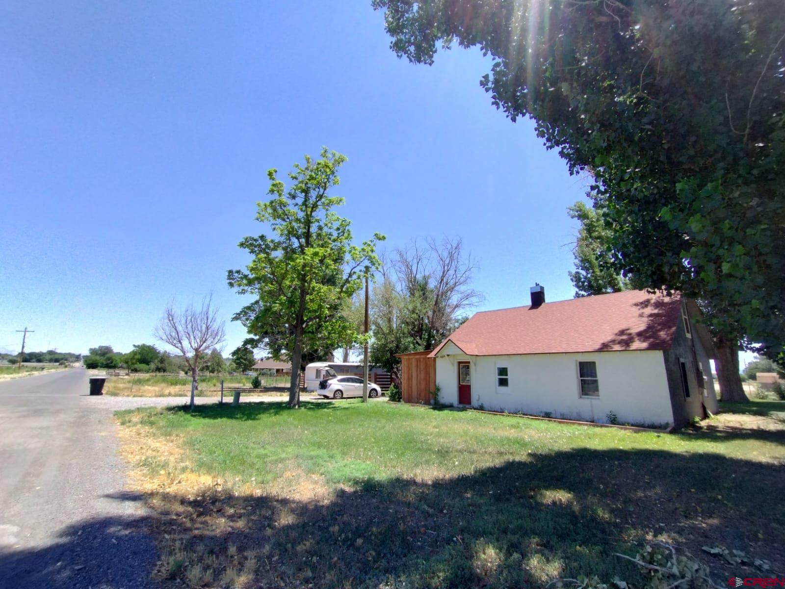 3/2 Home + a 2/1 rental mobile on 1.1 acres.  STABLE - INCOME PRODUCING 2 UNITS on 1.1 acres. FULLY OCCUPIED - DO NOT DISTURB TENANT month to month leases. Live in one residence and rent out the other? The Main stick built adobe home (1020 16th st ) is 1, 392 feet (3 /2) 2 stories - newer flooring, newer paint, newer $4000 furnace, and new hot water heater! Lots of upgrades!  The 1st rental/mobile (1010 16th st)  Main home has 2 upstairs bedrooms, but the master bedroom and master bath are on the main floor. 804 SF 2/1. New Flooring, Paint, Roof re-coated . Both units have W/D hookups and exterior storage sheds. Remodeled 2020. 2 sewer and 2 water taps (15k plus value) . Tenants pay their own electric, gas, water, sewer, trash.  2 separate addresses. ( 2 showers in home, no tub) Rent/income monthly currently is 2,050 a month combined.  2 out NEW hot water heaters, new stone and wood interior upgrades. 2 granite counters. New vanity's! Homes are older but have a vibrant modern feel.  The west border is an alley for private access to the back of the parcel. Irrigation water cuts thru the property, easy for distribution - plenty of water! Some new fencing to help with separation.   Current rents below market.