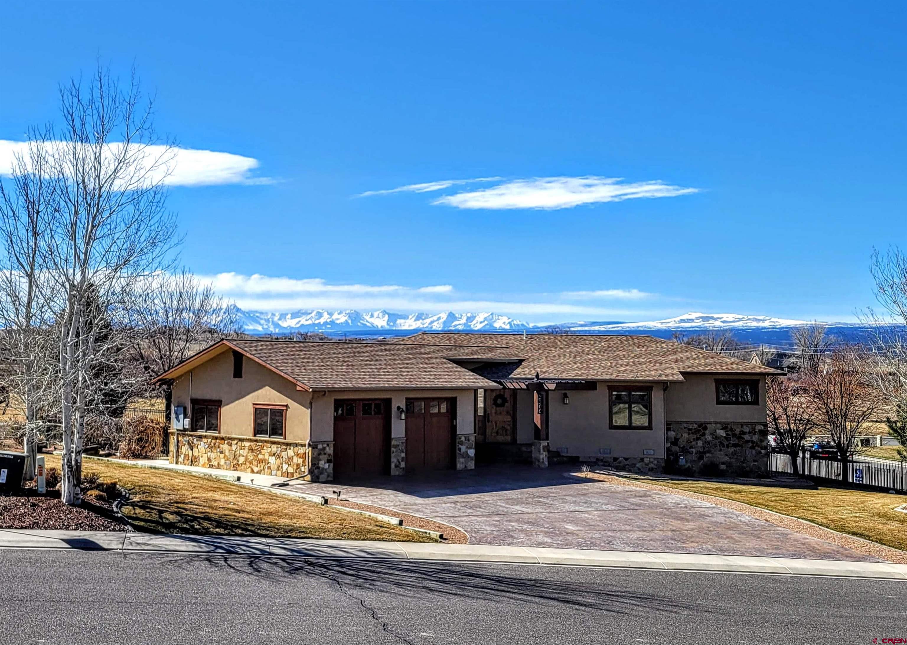 It just doesn't get much better if you're looking for the highest quality in design and craftmanship, awesome views of the San Juan Mountains,  and a prestigious location in the 1st Filing of the Brown Ranch Subdivision. You will also appreciate the close proximity to local attractions such as the Bridges Golf Club, the City Recreation Center and all the retail and restaurant options at the south end of town.  The 1/3 acre Lot borders open space on the south side, and beautiful trees, landscaping and perimiter fencing around the back yard.  The main level of this southwest style, contemporary home features 2,034 SF of Great Room with a gormet-class Kitchen and a huge Master Bedroom Suite.  The Great Room includes a gas-log fireplace with hearth and surround adorned with Brazilian stone. Majority of flooring is engineered hickory.  The Kitchen, baths and laundry room all have Italian porcelin tile floors. All built-ins, cabinets and woodwork are stained alder. Countertops  are all seamless Corian.  The kitchen has a large island with a built-in cook top and retractable exhaust fan. Appliances  are all stainless steel by Kitchen Aid and Kenmore Elite.  The Master Suite is uniquely laid-out with an internal hallway to access two separate walk-in closets, the 5 piece Master Bath, plus your choice of two rooms, located front and back; one for sleeping and the other for office? den? fitness?  The Master Bath has double vanities, a soaker tub, and a walk-in stone tile shower.  From the garage you'll enter a mud room which connects to a walk-in pantry and spacious laundry room.  The Maytag Washer/Dryer set are also included.  There are 3 decks off the south and west sides of the main level.  The kitchen deck has a pergola and includes a gas grill with natural gas hook-up.  The living room deck is wide-open and provides the best 180 degree views.  Another spacious deck off the Master Bedroom is fully screened-in and covered for relaxation and privacy.  All decks utilize Trex decking and metal railings. The 1,100 SF walkout basement has two bedrooms, a full bath, a sitting area, and a large storage/mechanical room. Flooring consists of colored stamped concrete.  Additionally, the basement area may be closed off from the main level via a sliding, solid wood barndoor.  The garage contains a large safe and TESLA  Car Charger, which are both included. Overall this home will impress with it's style, functionality, and "like-new" condition.  Be sure to checkout the Matterport Tour link.