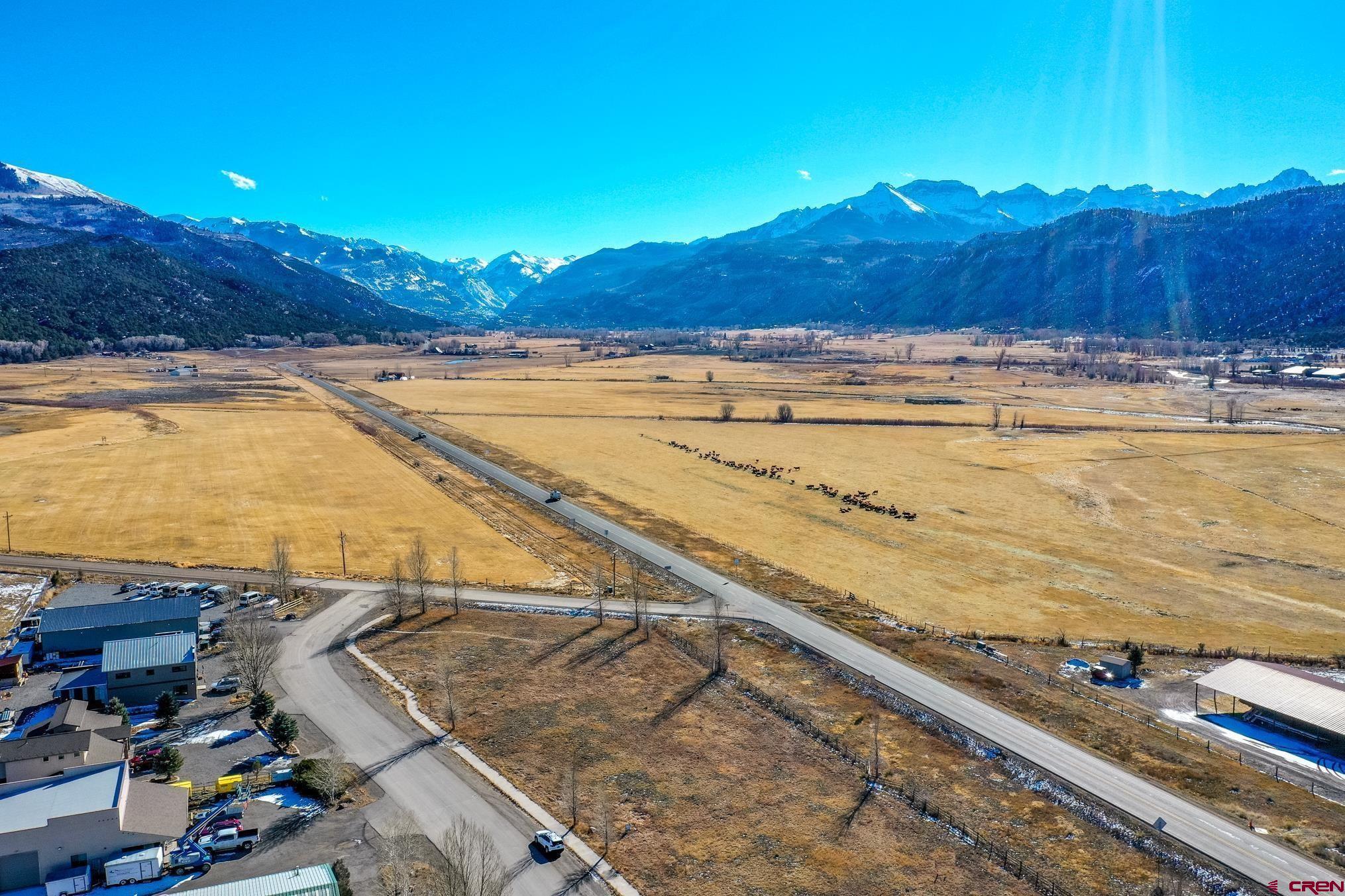 Highly visible COMMERCIAL lot in Ridgway with HIGHWAY 550 FRONTAGE. Exception views and southern exposure from this special property. This is a great investment opportunity and must be sold with the adjoining property  (see listing #800615). Multiple opportunities on this rare commercially zoned lot with unparalleled exposure in Ridgway. Accessible via County Road 12 (off Hwy 550) or Hunter Parkway (Zoned: General Commercial)