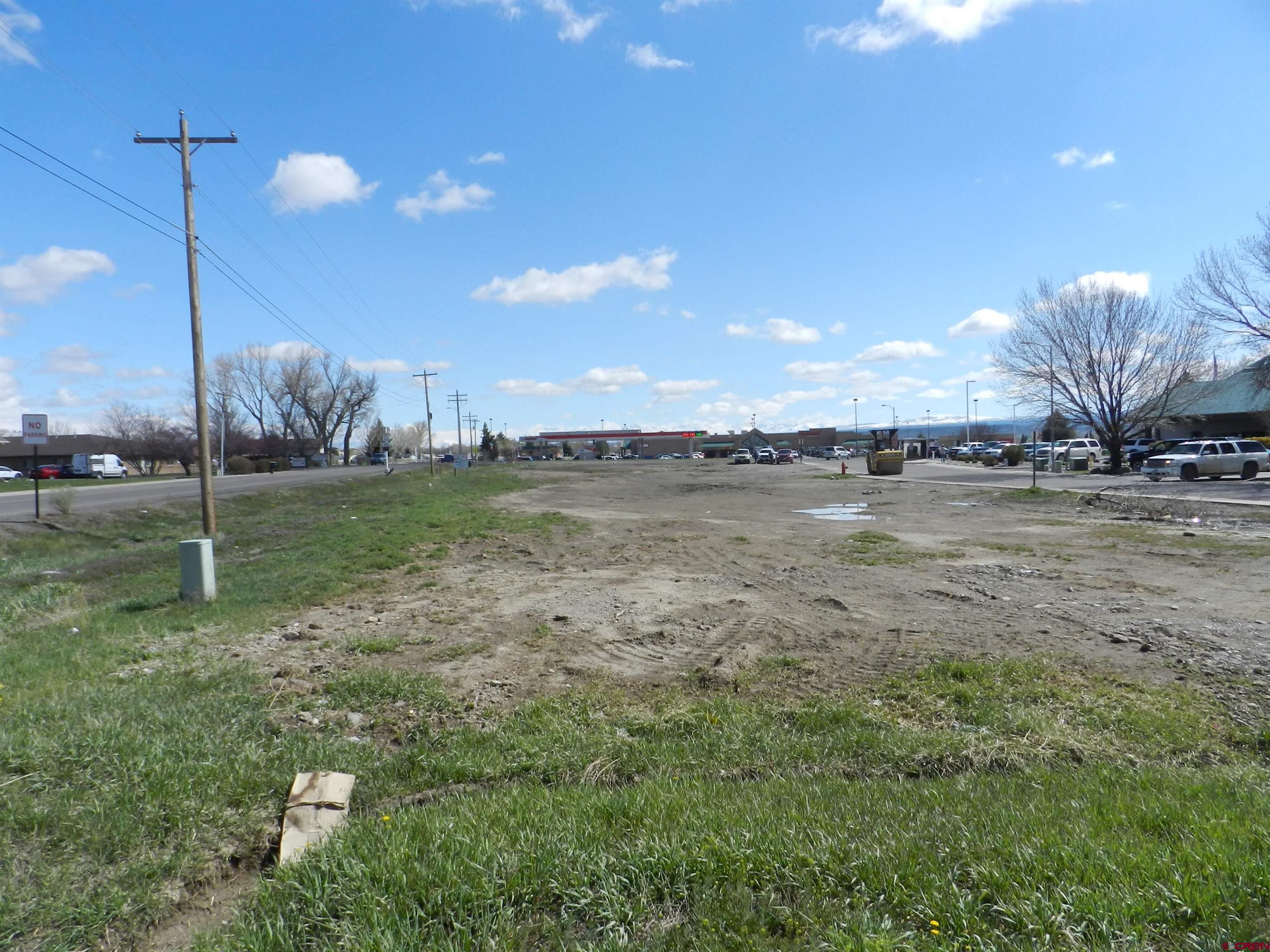 RARE COMMERCIAL LOT IN BOOMING SOUTH TOWNSEND CORRIDOR!   Commercial Lot Ready for Development in Highly Desirable Location.   Property is situated one block East of S Townsend Ave/S Hwy 550 with 28,000+ daily vehicles. 1.22 acre (MOL) lot has easy accessibility and visibility from Woodgate and Odelle Rds. This property is part of The Alpine Bank Business Park, a well-established complex consisting of a variety of major retail and dining establishments. Surrounding businesses include City Market, Denny’s, Starbucks, Qdoba, McDonalds, Quality Inn & Suites, and Alpine Bank. Zoned B-2 Highway Commercial in the City of Montrose, this district is intended as a shopping and business center for the City and surrounding area. All utilities are available and to the lot. Take advantage of shaping the future of Montrose’s South Corridor commerce!