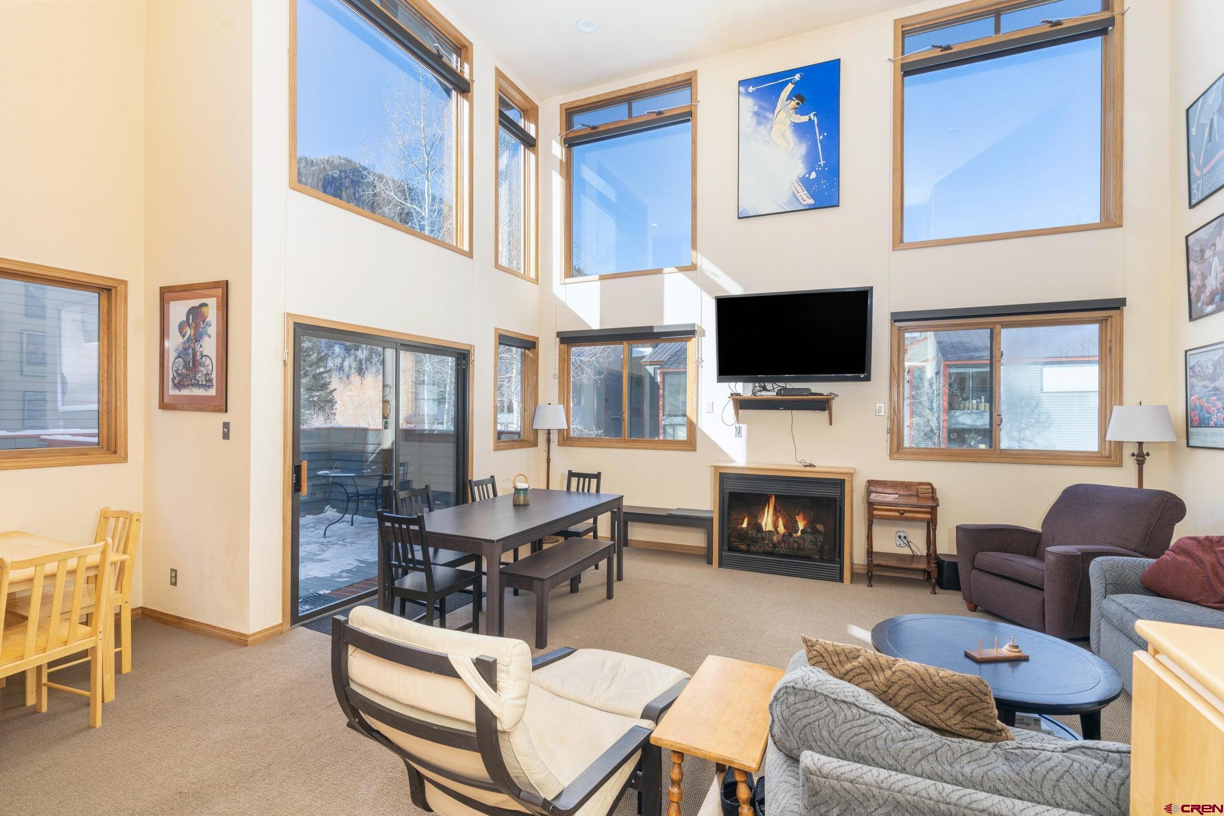 Here's an excellent opportunity to enjoy a classic ski condo or transform it into a top of the line mountain chalet. Nestled 125 yards from lift 7, the river & grocery, this residence enjoys lots of green space with room to picnic & BBQ. It offers big mountain views & is located in our charming historic town. Enjoy cozy, warm spaces designed for relaxation. Two separate living areas allow for maximum privacy & fun time with kids & adults, or two families. A soaring ceiling, minimal common walls, & a sunny, private deck allow plenty of elbow room. Upwards of 900 add'l sq.ft. can be utilized by creating extra spaces by expanding vertically into the attic & also the lowest level. Potential exists to convert into two separate units. Get a STR license for short-term rental possibilities!