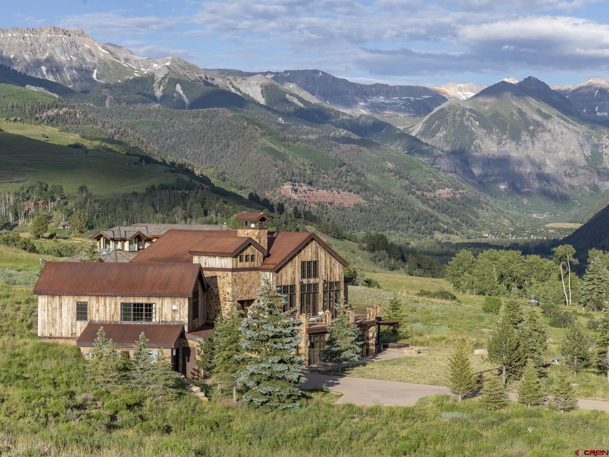 Timeless and tasteful, this rebuilt, pre-civil war home offers the combination of quality design, sun-splashed days and 180-degree views, including the famed Wilson Mountain range that defines the Telluride Region. Old meets new, with hand hewn posts and beams boasting a finish level deserving of a luxury Mountain Retreat. Less than five miles from all the action and convenience of downtown Telluride and the world class Telluride Ski Resort, Meadows at Deep Creek subdivision is private and peaceful neighborhood with just eight lots on a dead-end road. Built in 2009 with a full remodel of the lower level in 2017, this residence features four bedrooms with four ensuite baths, two half baths and a highly versatile loft.