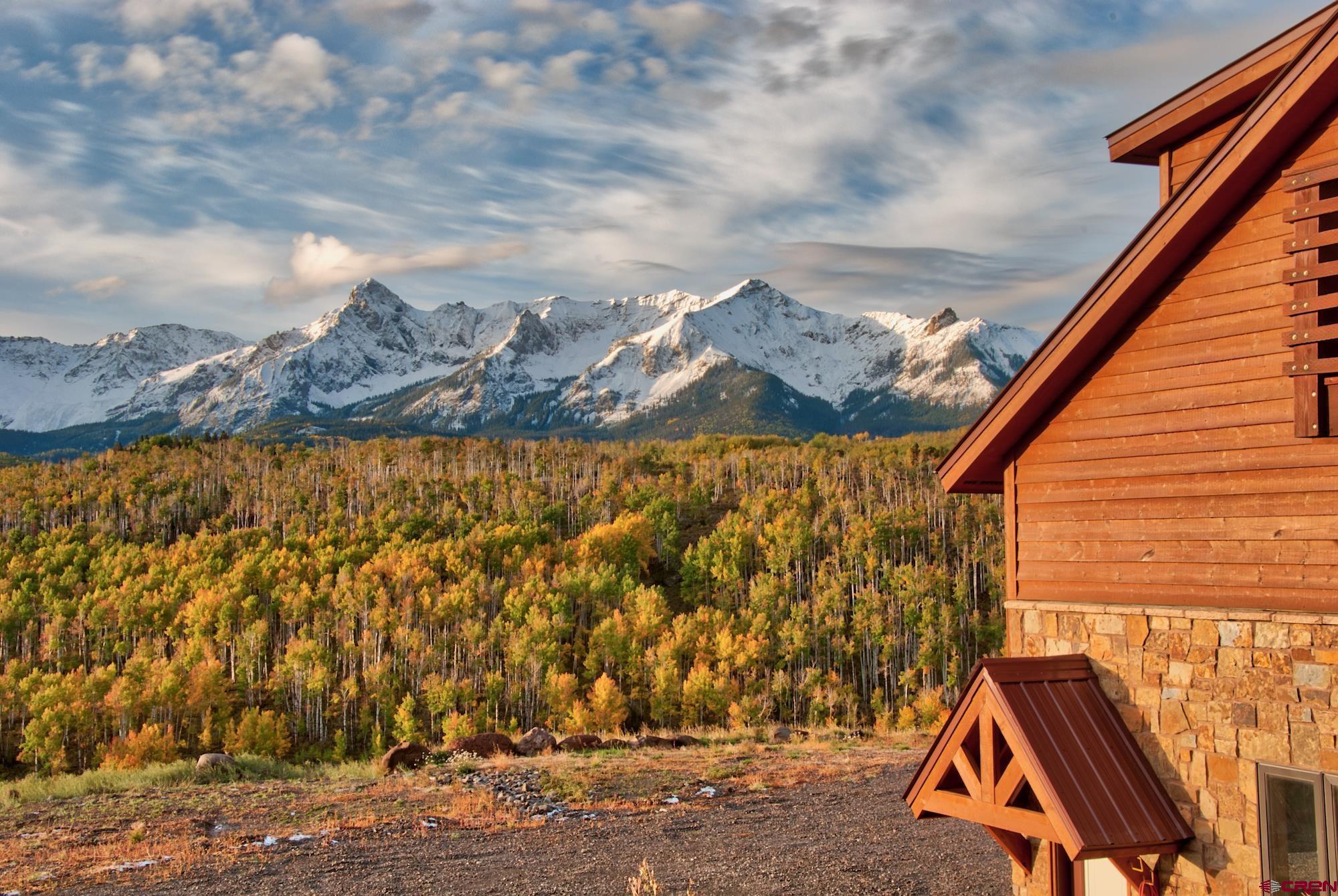Looking for the ultimate in privacy, security and the best views on Colorado's Western Slope? Here it is! Located at the very top of the iconic Dallas Divide! Colorado Life magazine (September/October 2016) named Snow Drift Ranch on the Dallas Divide as the number one location in the entire State of Colorado to view Autumn colors. Secluded and very private yet has year round access along Colorado Hwy. 62. 15 minutes from Ridgeway and just 35 minutes from Telluride. The home was built in three phases and is truly an engineering marvel. On grid plus there is a total self sufficient off grid option.  This home has so many great features that it would take hours to explain everything. Breathtaking views, comfort and convenience in any event with accessible seclusion. It has everything including a state of the art security system. This gem could easily become a first class equine facility with ample acreage for barns, an arena and pasture. If hunting is what you desire Elk and Mule deer frequent the property and over the counter Elk tags can be bought annually. With the famous Double RL Ranch across Hwy. 62 allowing extremely limited elk hunting, this makes hunting on the Snow Drift Ranch extremely good. Skiers and golfers have the best of both Worlds! Telluride with it's World famous skiing, dining and shopping is just a short drive away and the Divide Golf club which offers memberships and is open to the public is minutes away from your front door! And of course Ridgeway being just fifteen minutes away has it's offerings, shopping, farmers market, festivals and Rodeos to entertain the whole family. The amazing home could accommodate a large family and guests or could serve as a corporate retreat/meeting facility.