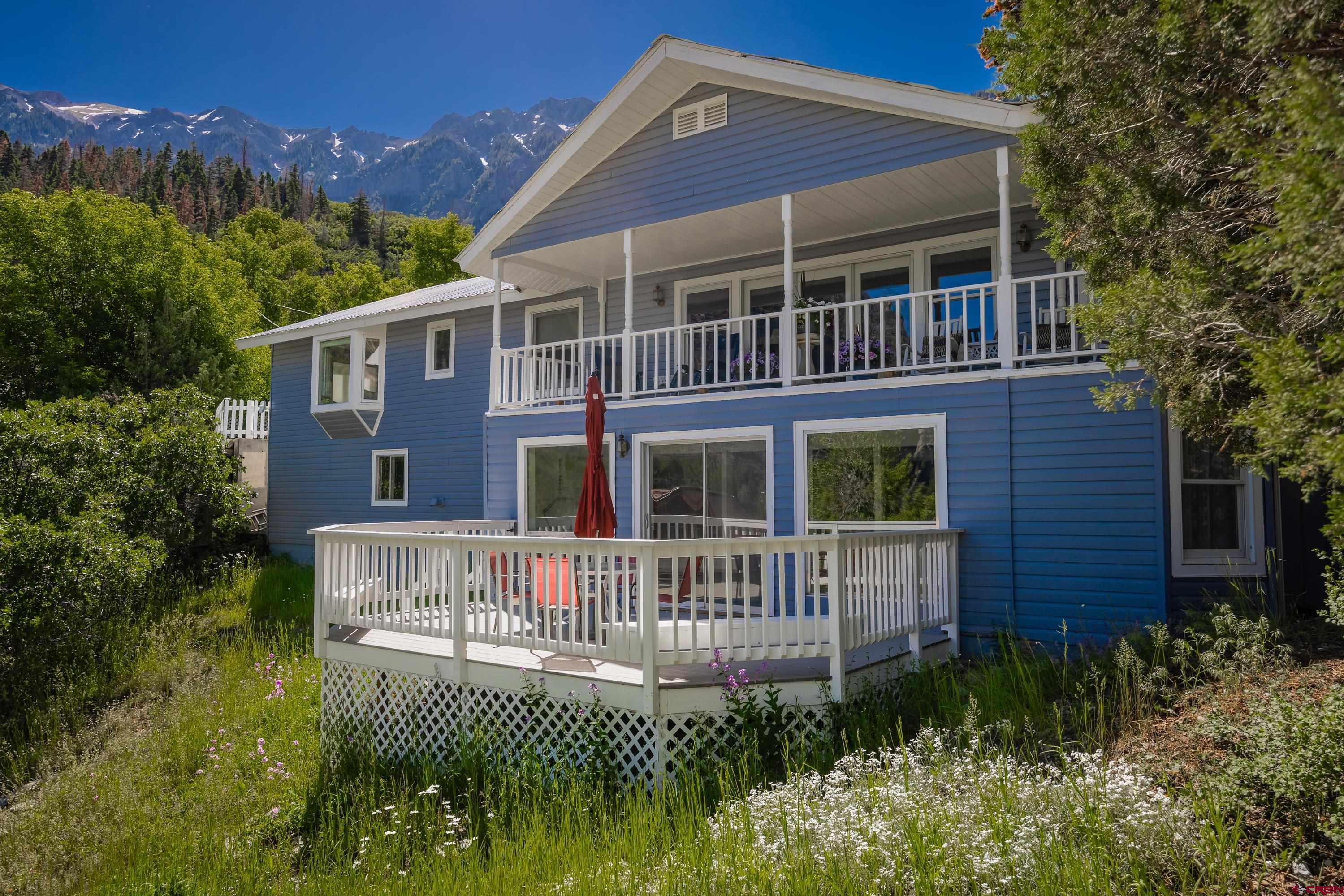 Sitting above Ski Hill in the city of Ouray this home is an entertainers dream! With multiple outdoor areas to entertain guests while enjoying the 360 degree views of the mountains. This home is a one of a kind. With 4 bedrooms and 3 bathrooms there is plenty of room for guests to come visit. There is an apartment downstairs that can be used for rental income or more space for friends and family. There are multiple over sized decks to relax on and take in the spectacular views! There is tons of storage through out the home. This home has breathtaking views from every window!