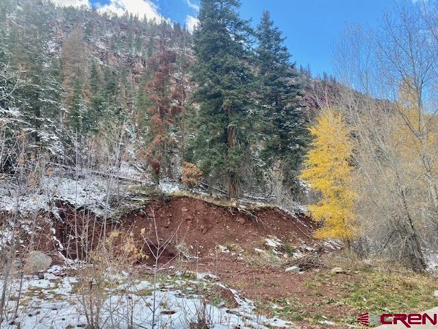 So many possibilities with this rare piece of land located in beautiful Ouray, CO - known as the Switzerland of America! Build your mountain dream home to be your permanent residence, 2nd home, or possible vacation rental.  Maybe you are an investor looking to maximize the space with a 4 plex - this R-2 zoned land allows so many possibilities.  Located on a very quiet, private street, this spot has it all, including mountain views.  One street over lies the famous Uncompahgre River trail making it a perfect location for a walk or cross country skiing/snowshoeing.  One can even take this trail into town (1 mile) and enjoy all the natural beauty along the way.  In addition to the river trail, the property is steps away from hiking trails allowing a person to never have to drive to get out and explore the surrounding mountains.  The Seller also has completed a berm for rock fall mitigation which has been approved by the City of Ouray.