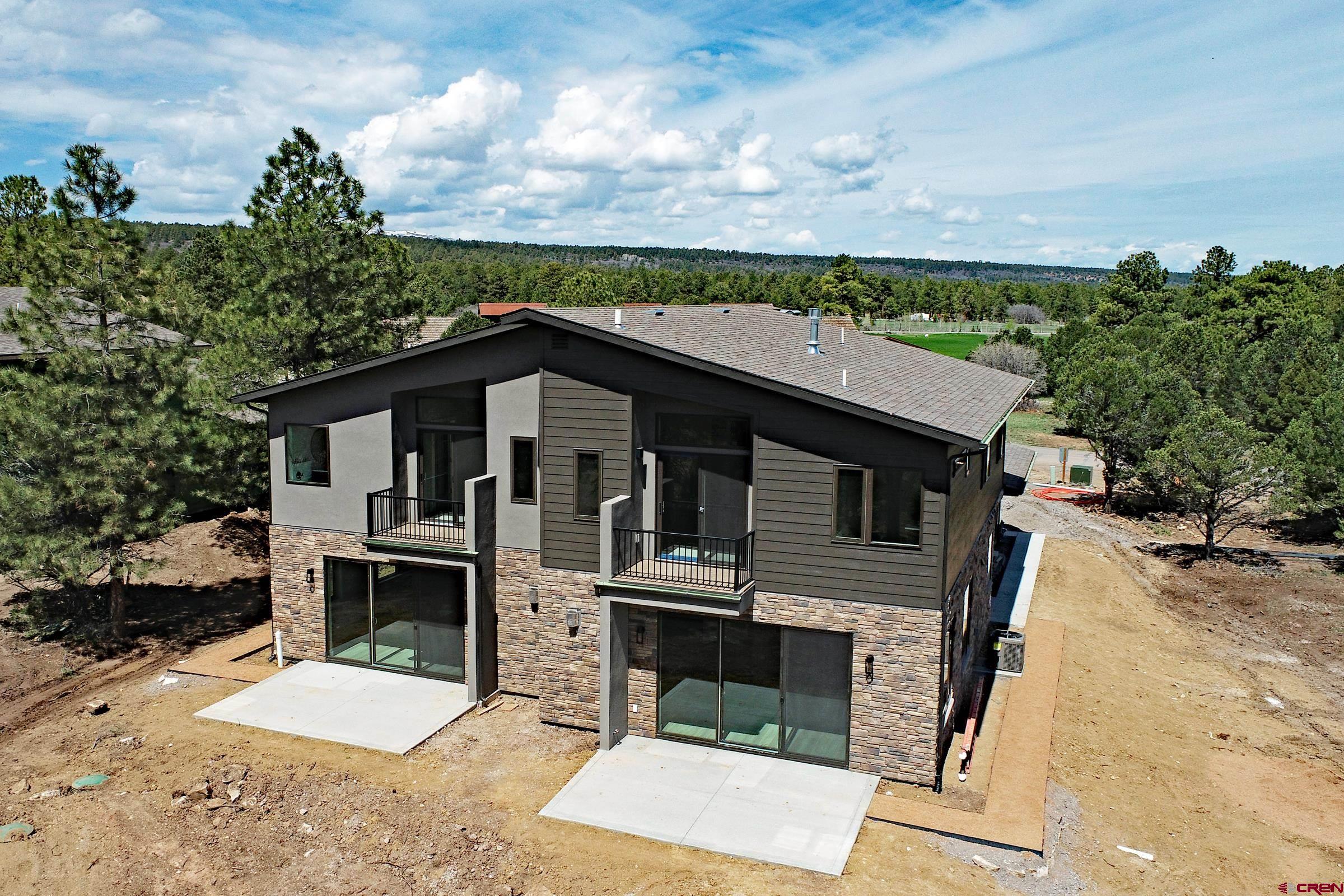 Stunning new 3 Bedroom duplex residence with sweeping majestic views of the San Juan Mountains.  The large open frontage borders the 18th Fairway of the Divide Ranch and Club golf course.  Designed by one of Colorado's premier architects, this residence features a huge custom kitchen, bright and open great room, and a large master suite complete with awesome views from its private deck.  The residence features an oversize two car garage, HVAC heating and cooling, Tankless water heater, and fireplaces in the living room and master bedroom.  Buyer can choose from a 3-bedroom model or a two-bedroom double master suite design.  These structures meet the highest rating of the new insulation code, and the exterior is maintenance free while also meeting the latest upland fire design requirements.  Seasonal owners will love the worry-free lock and leave potential of these residences.  These are duplex residences, and unlike traditional townhomes, the buyer will own the land that the residence is built on.