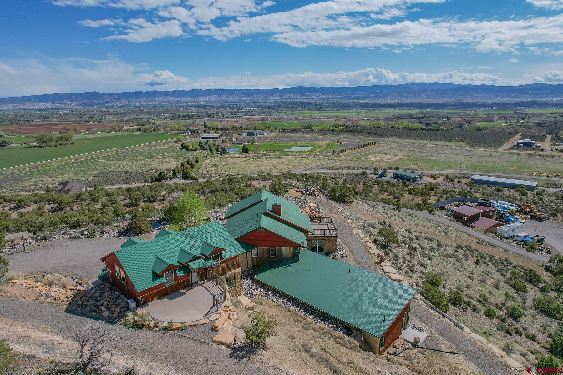 2022 Remodeled Home on 15 Acres For Sale, Montrose Located at the end of 6300 Rd in a serene and private area to the SW of Montrose, this 5,109 Sq Ft home sits on a gorgeous and picturesque view point with 15 acres. The home, named "Skyline Ranch", was remodeled in 2022 with high end finishes including engineered hardwood flooring, Knotty Alder trim and doors, all new appliances, as well new siding, windows, and roof to the homes most recent addition. There is no shortage of storage space, and plenty of options to furnish the 5,000 Sq Ft home as you please. The entire house is heated using in-floor radiant heat, and the master bedroom does have central air conditioning. The open concept living room / main level truly offers some of the best views with a generous amount of large windows. From the Grand Mesa, The Cimarron Mountains, San Juans Mountains, and Downtown Montrose, it really is spectacular and yet only 10 minutes from Main Street and Montrose / Telluride airport. The property is mostly dry, but does have mature vegetation, a small pond that wildlife use, Aspen trees at the front entrance, and a lovely water feature that welcomes you to the home. The house also overlooks a private airstrip with improved lots available for the aviation enthusiasts. There are also neighboring parcels for sale from the same owner.   Borders BLM (GMU 62), Airpark Community (7CO2), Large Workshop, Fiber Internet  Being one of the original homes in this small airpark neighbor (Ranger Ranch Airstrip), it has some of the best access to BLM public lands and the opportunity to own property on the actual airstrip. It is a dirt runway, perfect for larger tire backcountry planes, and STOL pilots. There are several hangars built next to the runway and aviation enthusiasts nearby. The 15 acre property does have a large heated shop that was built in 2000 and has concrete floors and plumbed for a bathroom. There is an ample amount of space and parking on the property for recreational toys, RV, or Camper. The home does have a brand new septic system adequate for a 5+ bedroom home, well water that is clean and pumps strong, as well Elevate fiber internet. There is strong cell reception and LTE service.   Montrose, Colorado - Hiking, Biking, Fishing, Rafting, Big Game Hunting, Skiing, Snowmobiling Montrose Colorado is a growing Western Colorado town known for its easy location, warmer climates, and abundant recreation. Just down the road is Ridgway and Ouray, Colorado - known for their famous hot springs, mountain climbing, and small mining town charm. A little farther down the road is Telluride & Telluride Mountain Resort for the summer and winter extreme sport athletes. Montrose, Ridgway, Ouray, and Telluride also have fine cuisine, local bakeries and coffee shops, and plenty of community events year-round. Moab, Utah is also a commonly visited town that is a scenic drive west and within 3 hours. The Grand Mesa is just north of Montrose and one of the largest flat top mountains in the world, offering over 300 lakes and ponds. Montrose is surrounded by ample opportunities for off-roading, dirt biking, mountain biking, rafting, hiking, fly-fishing, and snowmobiling. This property in-particular has jeep trails, single track, and rock crawling within a half mile and accessible from your driveway. This home is set up perfectly for the recreational type, aviation enthusiast, big game hunter, or someone who just wants the best views you can find within commuting distance to Montrose or Ridgeway, Colorado.