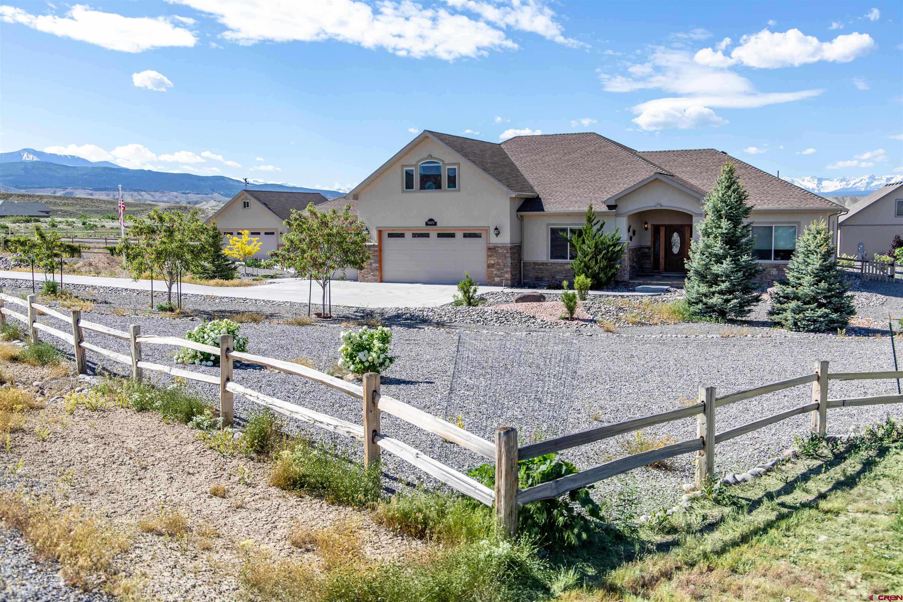 Feel your stress melt away as you follow gently winding roads through idyllic green pastures to this soundly built and well-appointed home nestled on just shy of 1.6 acres among the foothills of the San Juan mountains. This home is conveniently situated just 10 minutes from town, yet far enough away to offer sweeping mountain views and the full expanse of the starry night sky. With 4 bedrooms and 2.5 bathrooms spread out over more than 2,000 square feet of first floor living area, a huge 450+ square foot second-story bonus room, 3-car attached garage AND large detached 2-car garage with shop, this property has so much to offer. Interior highlights include new carpet, gas fireplace in the living room, Instant Hot water Heater, and a spacious master with HUGE tiled shower and direct access to covered patio. In the kitchen you will find beautiful granite countertops, knotty alder cabinets, hardwood flooring, and a 6-burner gas range that would impress any chef. Outdoors, a thoughtfully landscaped front walk and covered entry welcome you, while out back you can enjoy relaxing or entertaining on the large covered patio and fenced/ xeriscaped backyard, which is on a drip system for your convenience. Just prepare yourself for the astounding VIEWS, only one can dream of seeing these mountains from their bedroom or the back porch. The newer (added in 2021) detached garage has loft storage, power, and can be plumbed for future remodeling in mind; the shop and loft area could easily be converted to a guest house or other livable space if desired. Make your appointment now to come and see all that this special property has to offer!