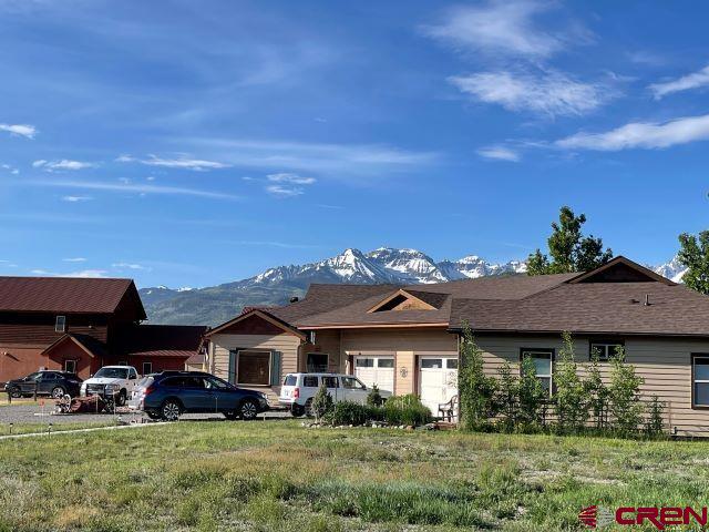 Great opportunity for a multi-family development project.  OR a single family home. This is a .48 Tri-Plex lot in River Park on Kismet.  Tremendous views of the Mountains.  Paved all the way from Town of Ridgway with the walking path an option.  Close proximity to the Uncompahgre River, the River Trail walking path and the Town of Ridgway.  There is $8540 paid towards the Sewer Tap and $7320 paid towards the Water Tap.  Water, sewer, power and natural gas to the property line.