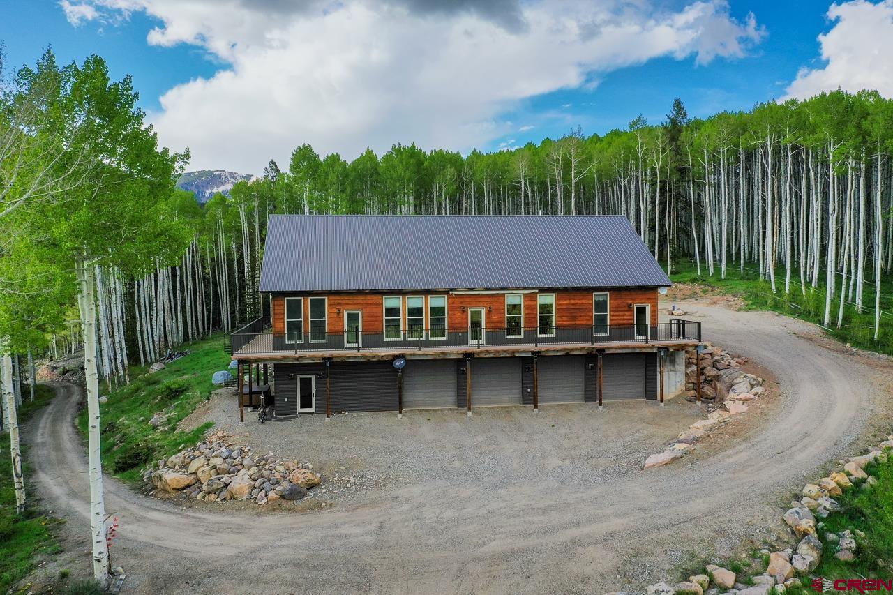 Absolutely stunning 2,800 square foot home positioned at the end of the Ohio Creek Valley sitting on 40 +/- acres surrounded by beautiful mountain and valley views.  Located 45 minutes from Gunnison and 1 hour from Crested Butte.  The kitchen features stainless steel appliances, custom cabinets, recessed lighting throughout and million dollar views of the valley while cooking.  Stay warm all winter long with in-floor radiant heat in the entire 3 bedroom/3 bath home and garage.  Two of the oversized bedrooms feature their own bathrooms and closet organizers.  The master bedroom has south facing windows with incredible views, his and her walk-in closets with a separate office/bedroom.  The laundry room/office has cabinets for additional storage or pantry items.  You’ll love the 2,800 square foot, 4 car oversized garage’s amazing work space with a walk-in cooler and 3 bay stainless steel sink.  Property has high speed internet from Xtream internet.   Carbon Creek runs through the acreage with an abundance of wildlife including elk, deer and an occasional moose.  This is a must see property!