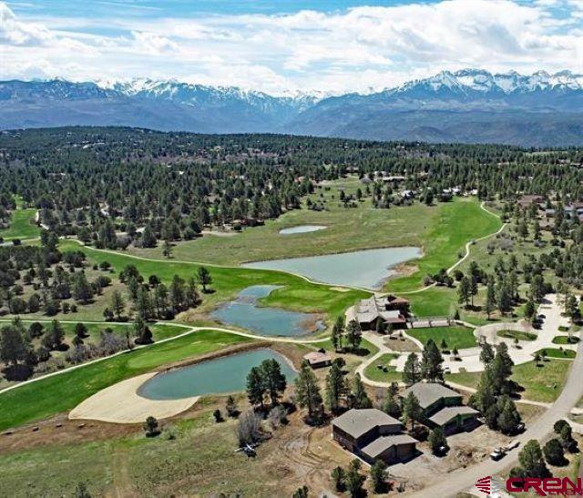 This stunning new 3 Bedroom  residence with sweeping majestic views of the San Juan Mountains. The large open frontage borders the 18thFairway of the Divide Ranch and Club golf course. Designed by one of Colorado's premier architects, this residence features a huge custom kitchen, bright and open great room, and a large master suite complete with awesome views from its private deck. The residence features an oversize two car garage, HVAC heating and cooling, Tankless water heater, and fireplaces in the living room and master bedroom. Buyer can choose from a 3-bedroom model or a two-bedroom double master suite design. These structures meet the highest rating of the new insulation code, and the exterior is maintenance free while also meeting the latest upland fire design requirements. Seasonal owners will love the worry-free lock and leave potential of these residences. These are duplex residences, and unlike traditional townhomes, the buyer will own the land that the residence is built on. Photos have been virtually staged with furnishings   Divide Ranch & Club Golf Course is the perfect spot to get your game on.  Even for those that are not avid golfers there is different scenery from every hole on the course that you do not want to miss out on. In the winter enjoy snowshoeing, cross country skiing and sledding throughout the community.  The clubhouse offers opportunities to meet with your neighbors for a cocktail and a bite to eat.   It is also a gorgeous backdrop for a special events including weddings, birthdays, or other small private parties.  The community is centrally located in Southwestern Colorado within close proximity to every outdoor activity you can imagine.  Enjoy skiing or snowboarding in world renowned Telluride CO in the winter and take advantage of the many festivals offered throughout the summer including, Film, Wine, Yoga, Blue Grass ,Blue‘s & Brew’s and many more .  Ouray, known as the Little Switzerland of the US,  is within 15 min where you can soak in the Hot Springs while looking up at the mountains and hike or drive to waterfalls. Fly fishing, boating, kayaking, paddle boarding, hiking, mountain biking and off-roading is literally minutes away from your front door.  When you are done playing in the mountains stop by one of the local breweries or dine in one of the restaurants.  Divide Ranch & Club is a hidden gem nestled in the San Juan’s and is the perfect spot for a forever home or a second home.