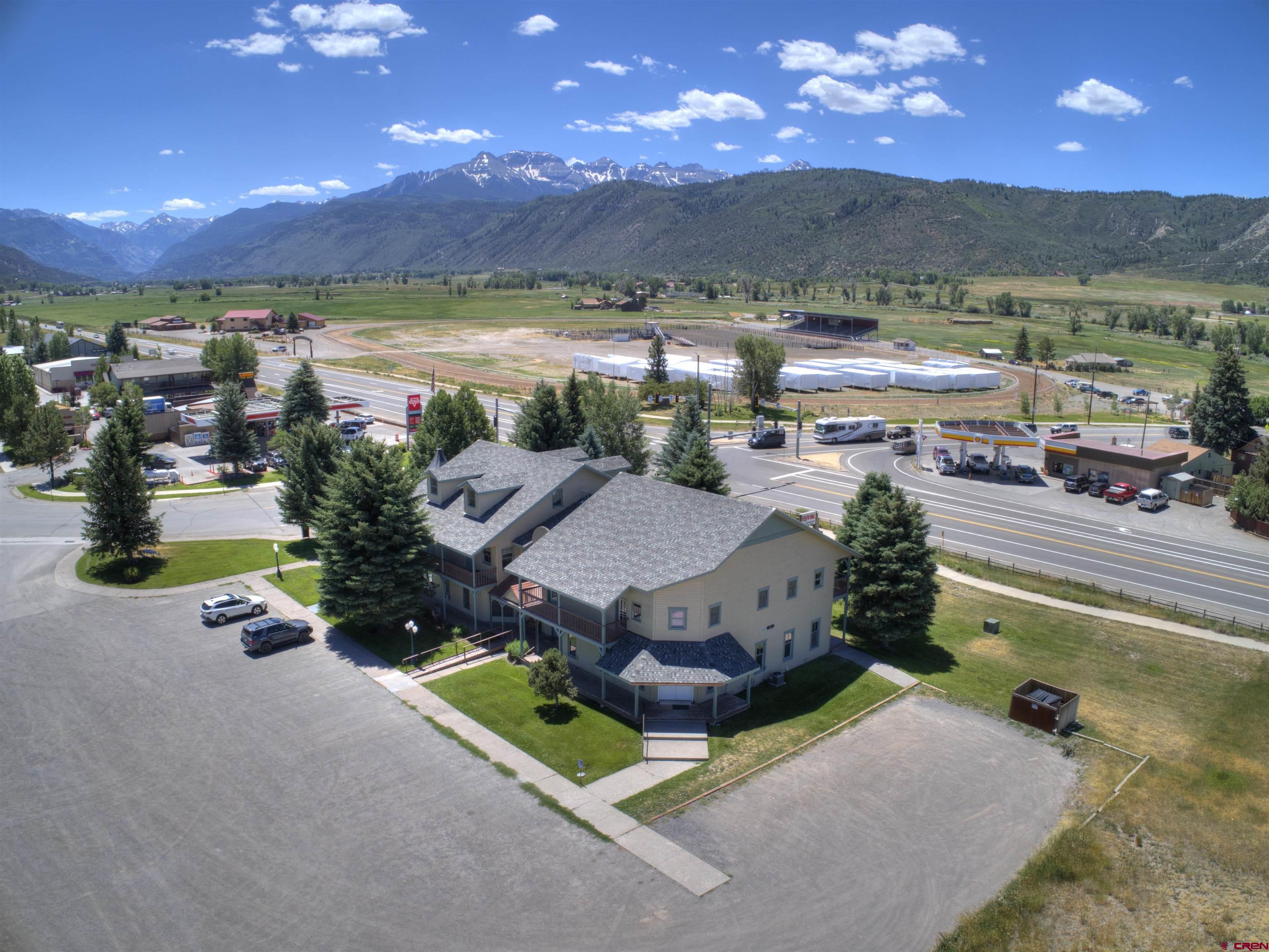 Great opportunity to own this large commercial building in beautiful Ridgway. Prime location and visibility at the intersection of Highways 550 and 62. Well maintained with roof replaced 2 years ago. Additional 8 acre parcel available for development. Building has been subdivided and various units may be sold separately.