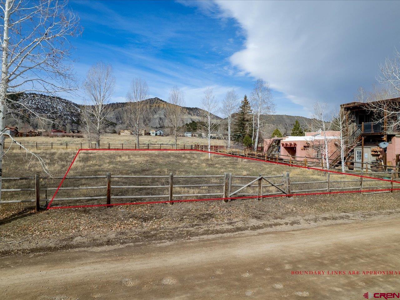 One of the most desirable subdivisions in Ridgway, Solar Ranch is close to downtown Ridgway for easy access shopping, Ridgway Town Park and restaurants. This gorgeous flat lot backs up to open space, walking and biking paths, giving you the mountain setting you are looking for. Make sure and take a look at the pictures for views on the lot, you have views to the south of the San Juan Mountain Range, and views to the east of the Cimarron Range.  Within walking distance of athletic field, this beautiful San Juan mountains surround this lot.   HOA dues are minimal, sewer and water taps available along with natural gas.  It is rare to have a lot available in Solar Ranch.