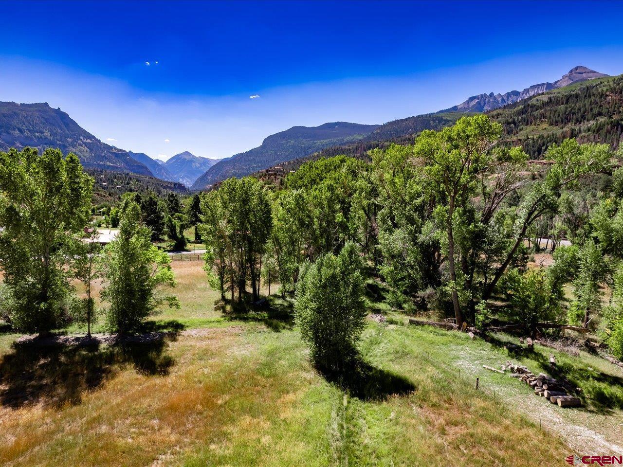 Build your dream home on this spectacular 8.125 acres of prime land in the heart of the San Juan Mountains on the valley floor between Ridgway and Ouray. The Uncompahgre River runs through the western boundary line, and a water storage pond is situated at the Northern boundary line which can supply plenty of irrigation water. Property is fenced along the boundary lines on three sides. Amazing views of Mt. Abrams and beautiful red canyon walls. Easy access to Ouray, Ridgway, Telluride and Montrose. Utilities can be readily accessed for tapping into and there are several lovely and flat building sites. You'll be able to take advantage of the endless outdoor activities, abundant festivals, unique shopping and much more with this sought after yet hard to find piece of paradise! Fiber optic was just installed at the property line. This incredible property won't last long so, make your showing appt. today!