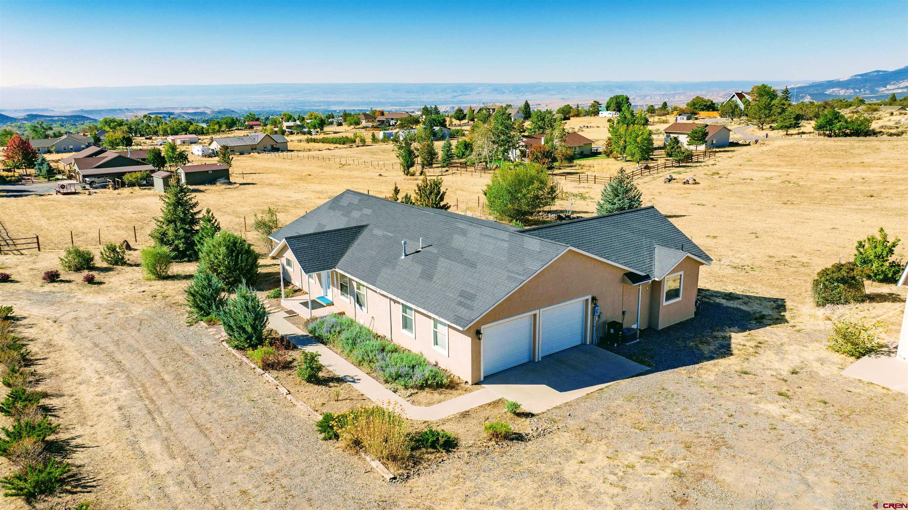 HERE IT IS! LOVELY RANCH HOME + GARAGE/SHOP BUILDING WITH SPACIOUS GUEST STUDIO APARTMENT ON 2.43 ACRES IN A SUPER CEDAREDGE LOCATION WITH VIEWS! This may be the Exact Property you have been Looking For! This is a Very Attractive 1-Level 1817 SF 3 Bedrm+Bonus Room/2 Full Bath Ranch Style Home that Features All New Vinyl Wood Plank Flooring, Wonderful Split-Bedroom, Open-Style Floorplan, Attached Finished 2-Car Garage & Delightful Back Patio with Gazebo. As if THAT wasn't Enough, the HUGE PLUS Here is the Large Additional 36’X28’ Heated Garage/Shop Building that Features a Very Spacious 900SF Studio Apartment Above. NOTE: The Total Square Footage of 2771 includes the 900 SF Studio Apartment. This Apartment, which can be Used for Guests or Additional Family Members is Fully Finished & Heated and Furnished, has a 3/4 Bath & a Natural Gas Log Stove for Extra Ambience, and Fabulous Views! The Amazing Lower Garage/Shop Part of the Building is Also Heated and Features its own Half Bath, an Insulated Storeroom Complete w/Shelves that can be used for Produce, Canned Goods or whatever else You Would Want to Keep in there. This Shop Building is Sided with Low-Maintenance Hardi-Plank Siding. Cycling Back to the Main Home, it Features Low-Maintenance Stucco Siding. The Huge Master Suite, Located at its Own Wing of the Home, includes its Own Door onto the Patio, a 6-Pc En-Suite Bath that features a Jacuzzi Tub, Huge Walk-In Closet & Radiant Heat in Addition to the Natural Gas Forced Air System that Heats the Entire Home. There is a Full Guest Bath on the Other End of the Home that Serves the Other 2 Bedrooms. This Beautifully Flowing Floorplan also Encompasses a Large Entry Foyer, a Bonus Room (that can be used for either a Separate Dining Room or an Office or Den), an Open Design Kitchen/Living Room/Breakfast Nook or Great Room, with All Appliances and Charming Bay Window Area Breakfast Nook. Back to the Large Garage Shop Building, there is an Attached Carport and a Site-Built 12’x20’ Storage Shed on Concrete Slab Next to That As Well! This Property is Located in a Premium Country Location of Well Kept Homes just outside the Town Limits of the Charming Rural Mountain Valley Town of Cedaredge, Chocked Full of Culture, Art and All Amenities and is the Gateway to the Grand Mesa, the Largest Flat-Topped Mountain in the World, Covered with Lush Mountain Terrain with Tall Aspens & Evergreens and 300 Lakes & Reservoirs, which offers a Multitude of Adventures and Experiences for Enjoying Colorado Mountain Living, including Nordic Skiing, Downhill Skiing, Snowshoeing, Snowmobiling, ATV'ing, Camping Fishing, Hunting, Hiking , Biking & Bicycling! Folks, It Just Doesn’t Get Any Better Than This!